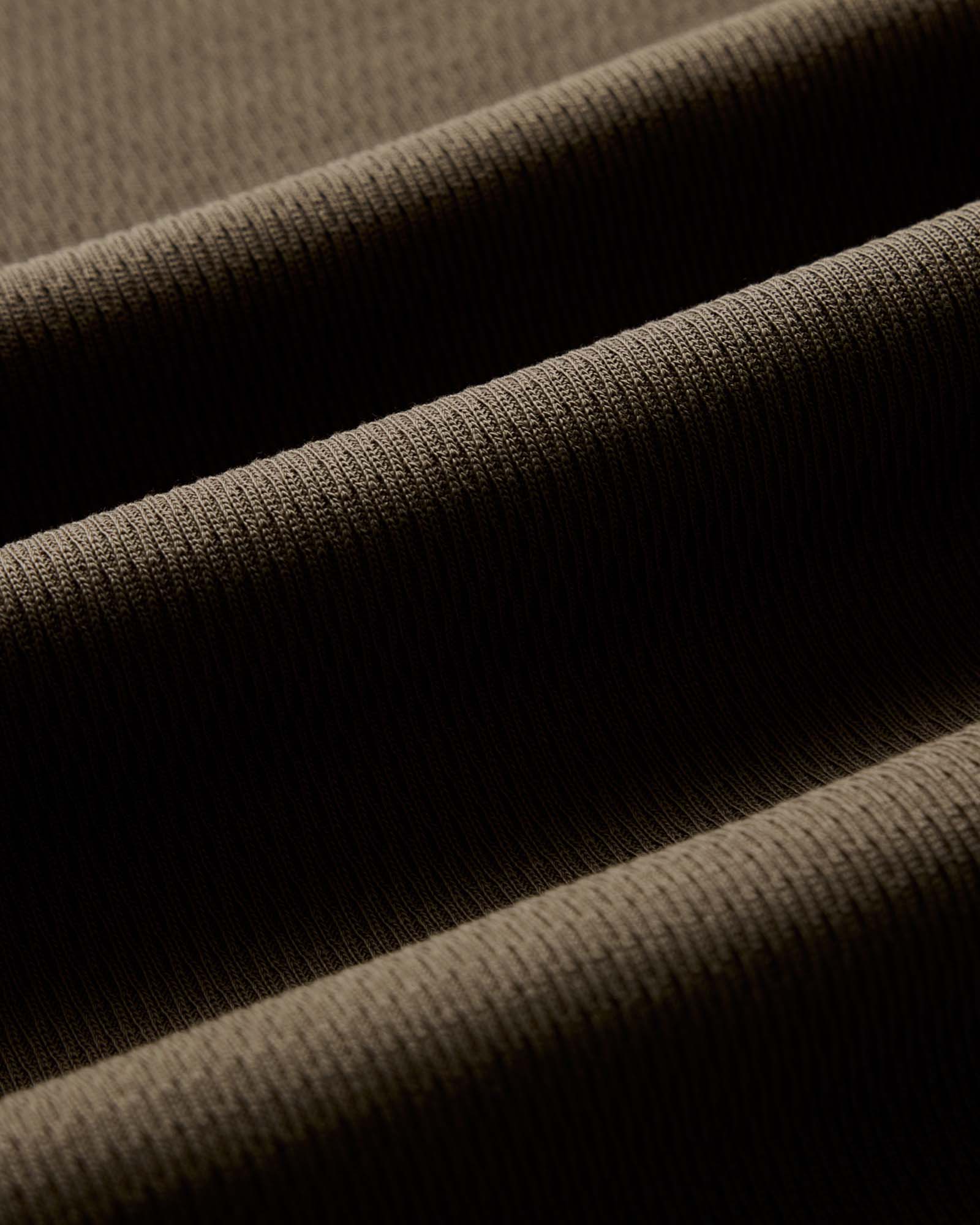 material shot of the waffle fabric on The Organic Cotton Short Sleeve Crew in Fatigue Olive Waffle, Knits by Taylor Stitch