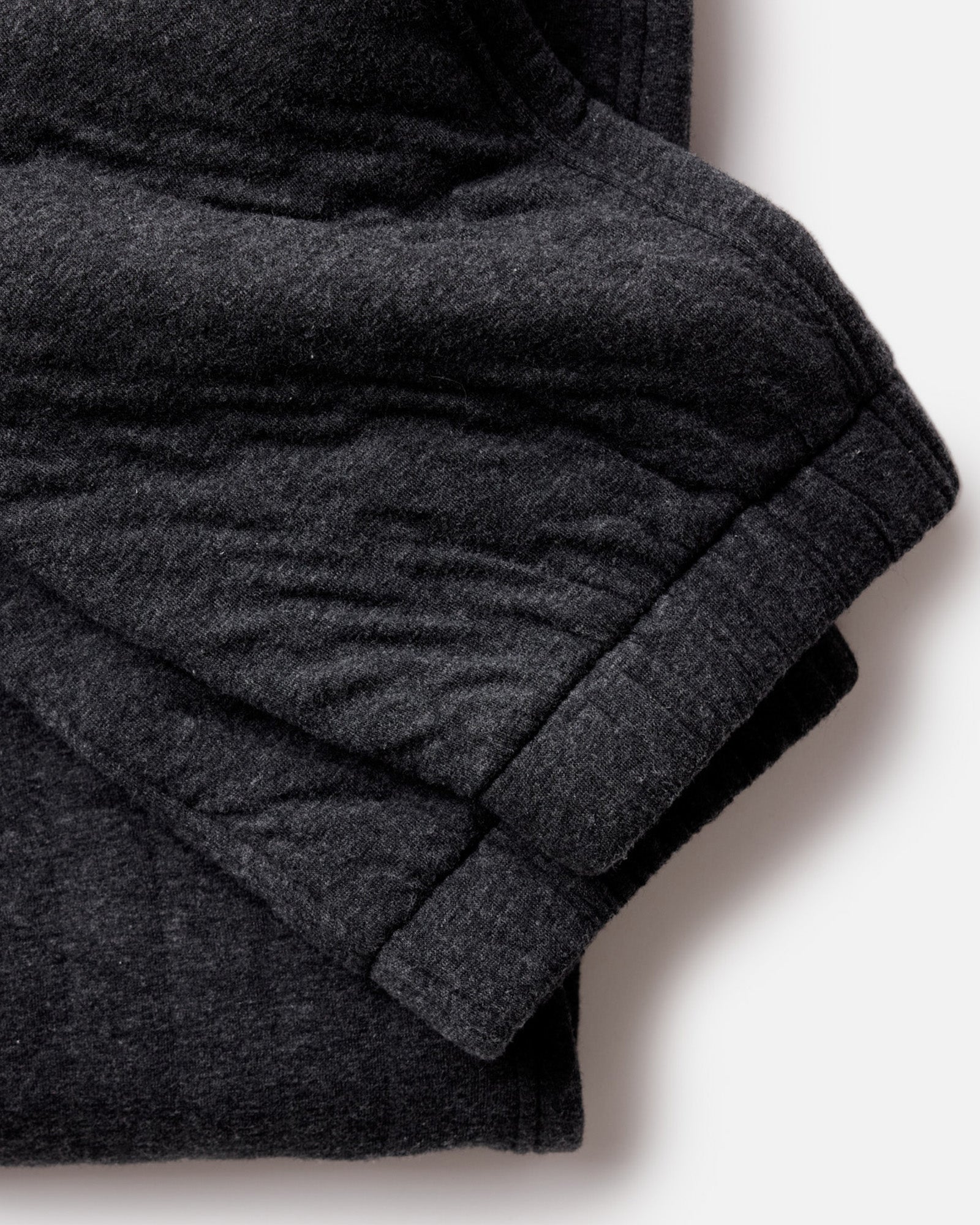 material shot of the cuffs on The Apres Pant in Heather Coal Quilted Jersey, Bottoms by Taylor Stitch