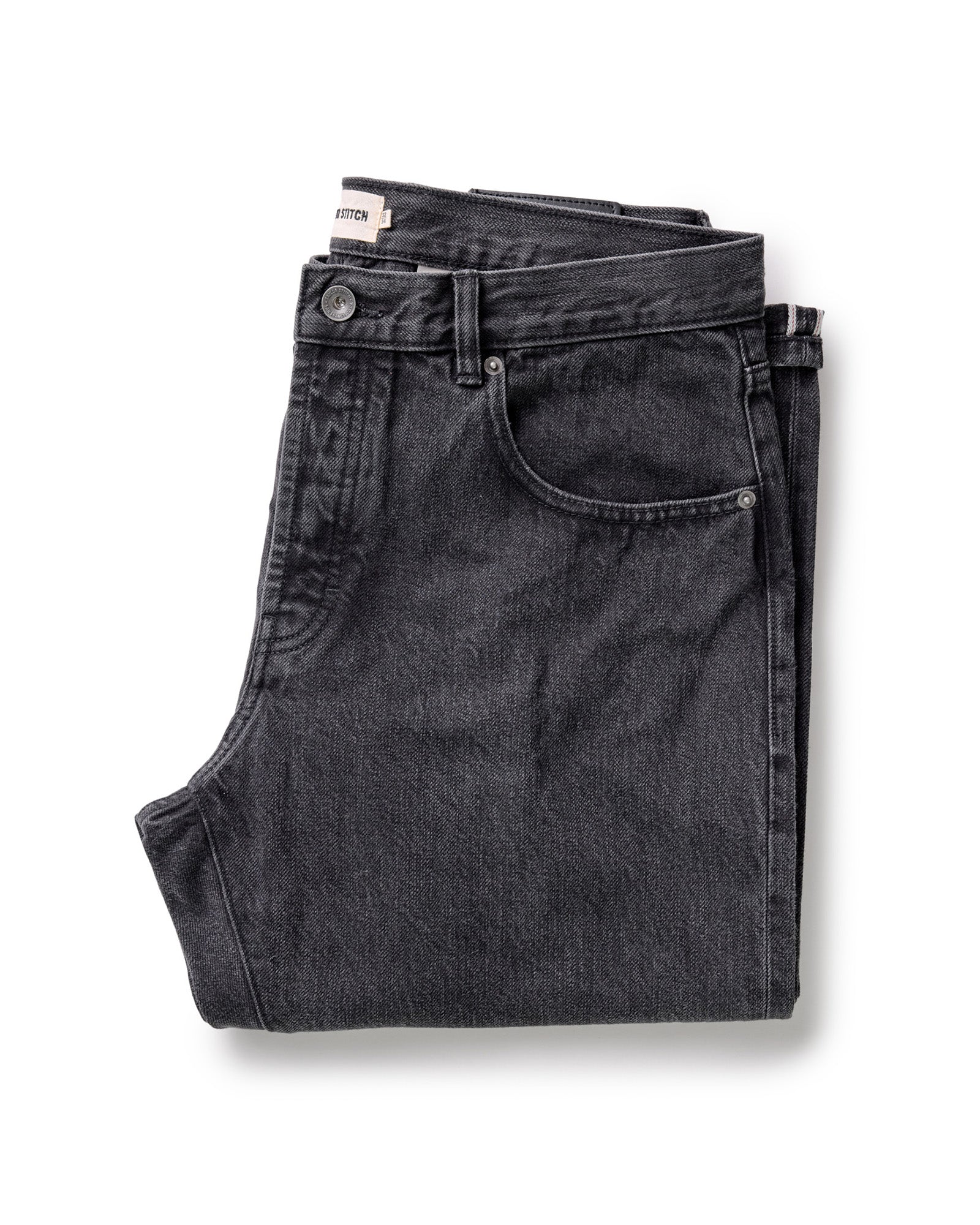 folded flatlay of The Democratic Jean in Washed Black Organic Slub Selvedge, Bottoms by Taylor Stitch