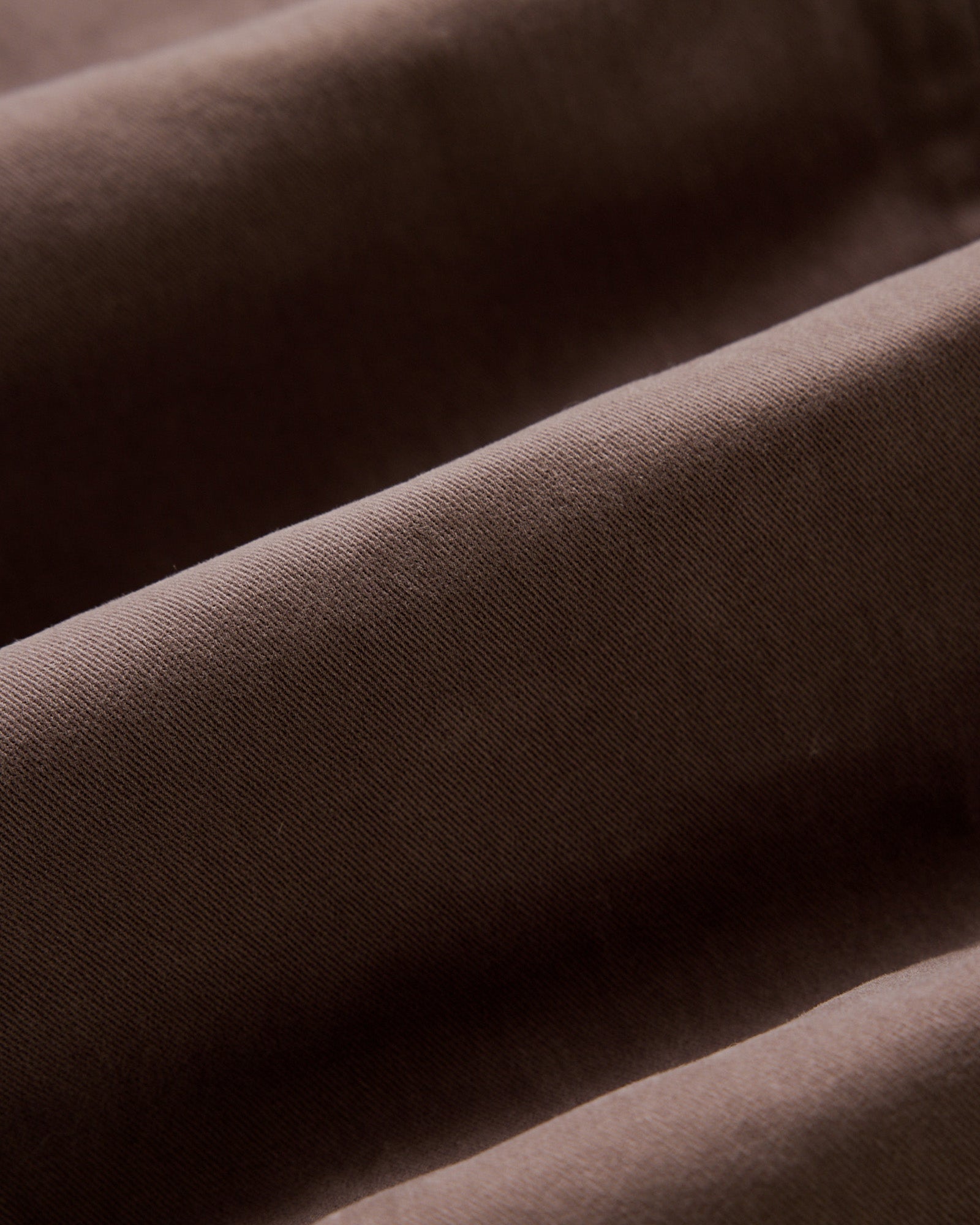 material shot of the twill fabric on The Slim Foundation Pant in Organic Espresso, Bottoms by Taylor Stitch