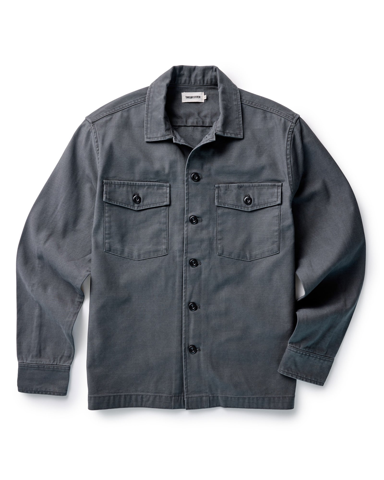 flatlay of The Surplus Shirt in Faded Black Reverse Sateen, Wovens by Taylor Stitch