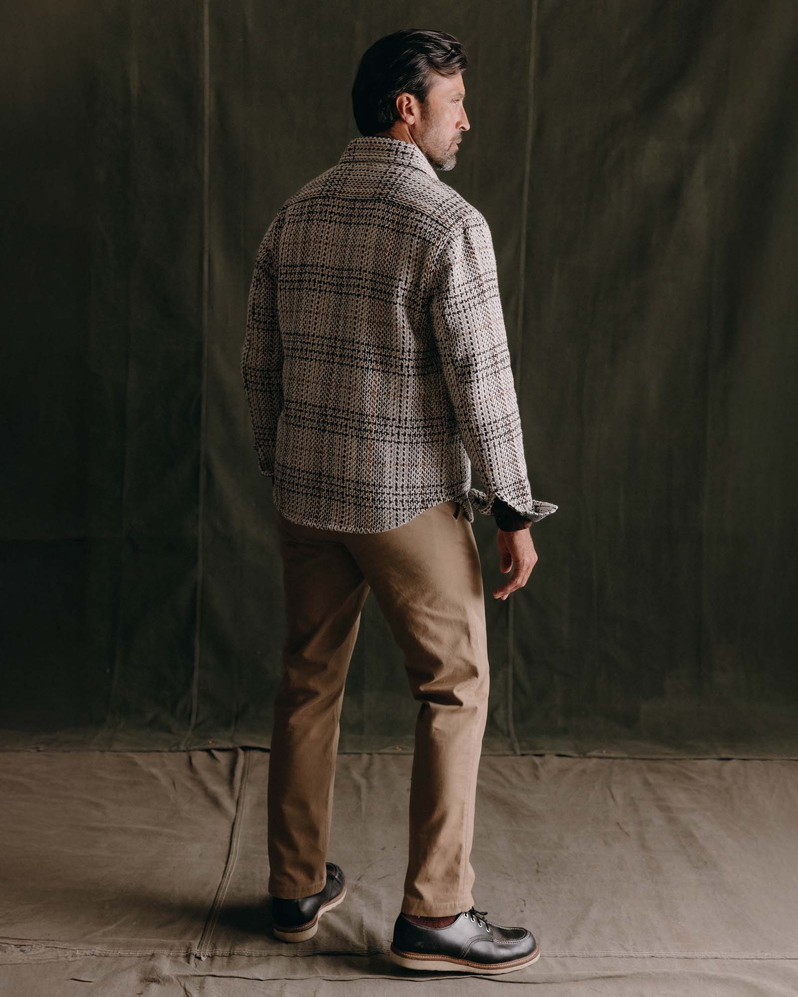 fit model showing off the back of The Cutter Overshirt in Stone Plaid, Wovens by Taylor Stitch