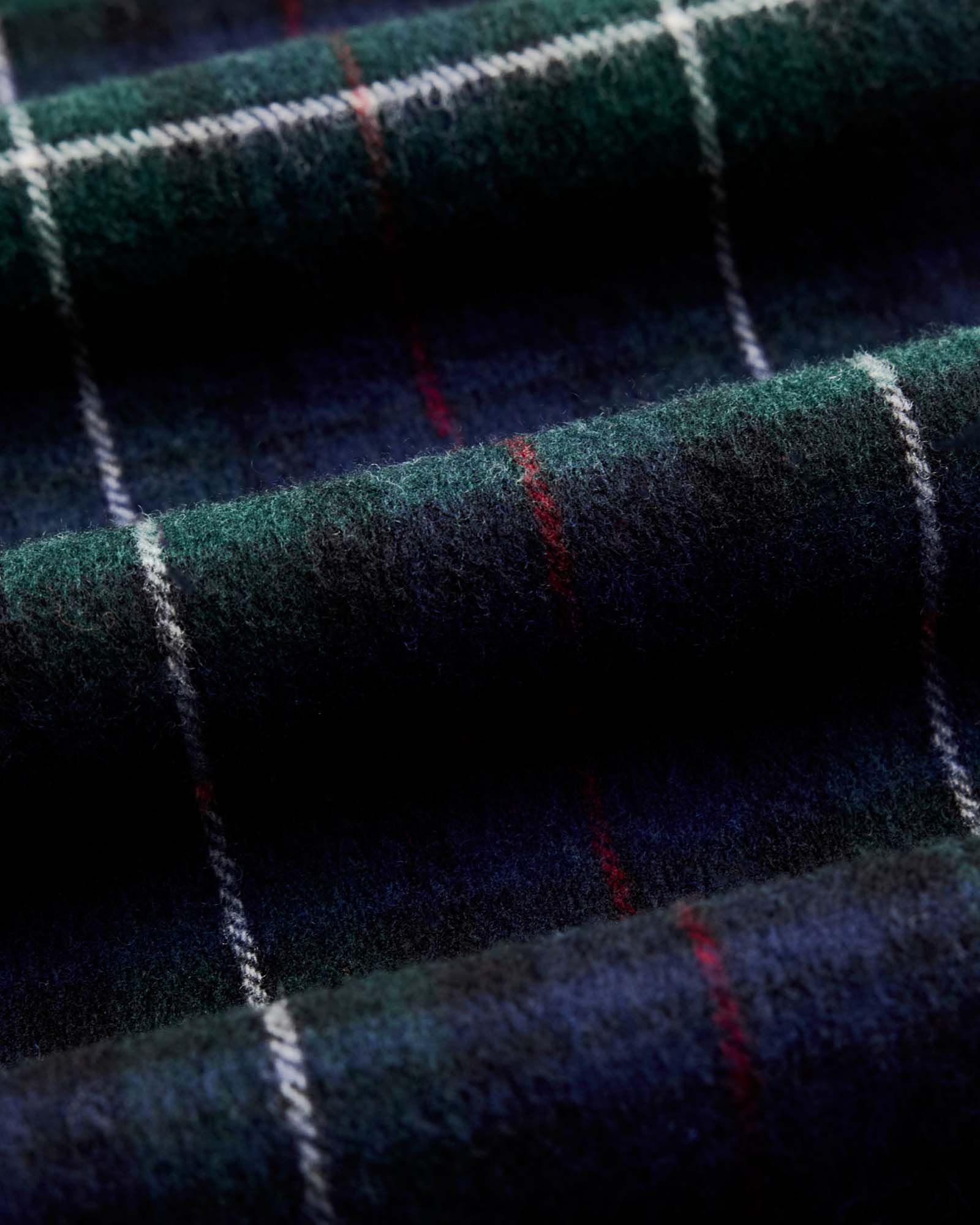 material shot of the fabric on The Fireside Scarf in Highland Navy Plaid, Accessories by Taylor Stitch