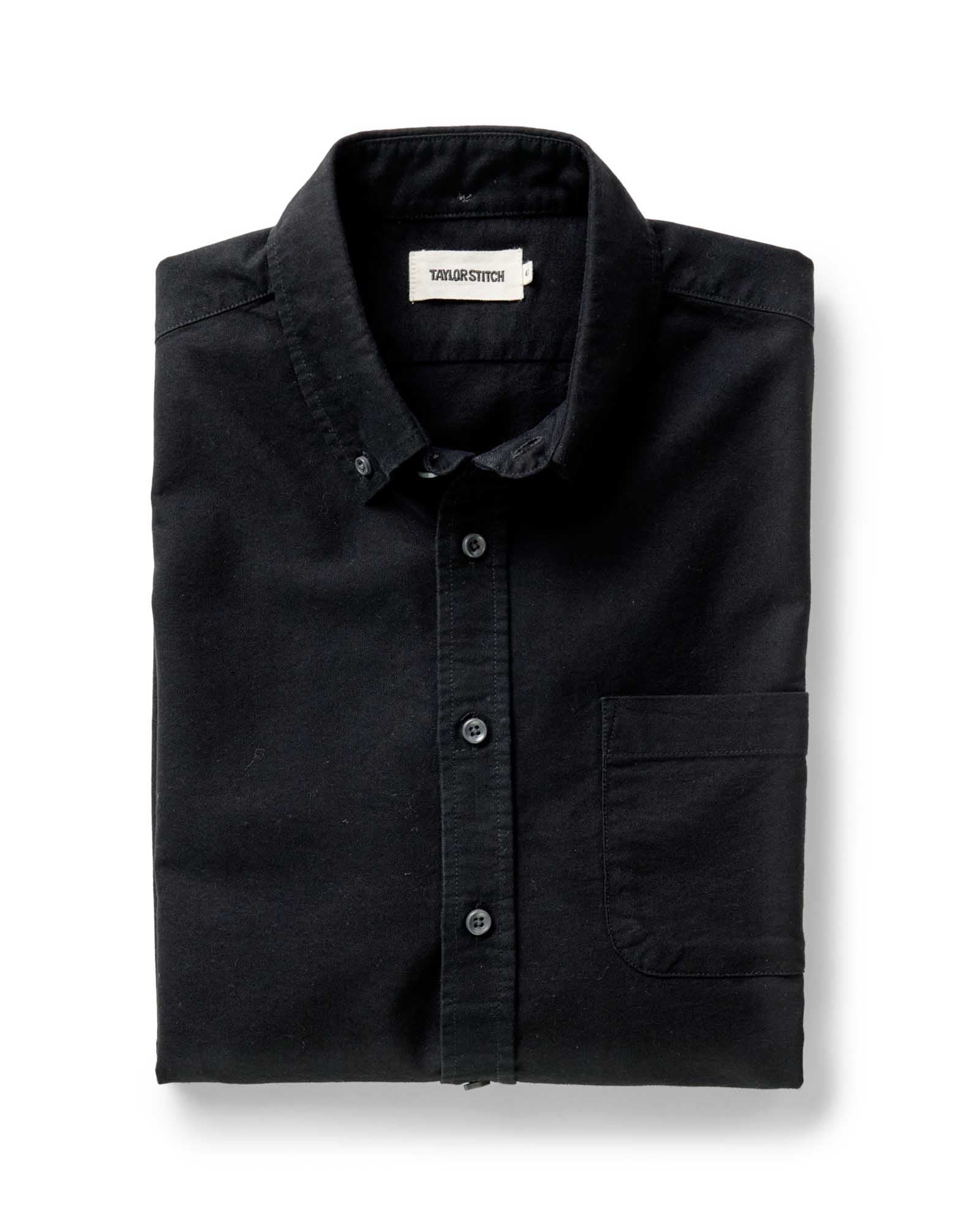 folded flatlay of The Jack in Black Indigo Oxford, Wovens by Taylor Stitch