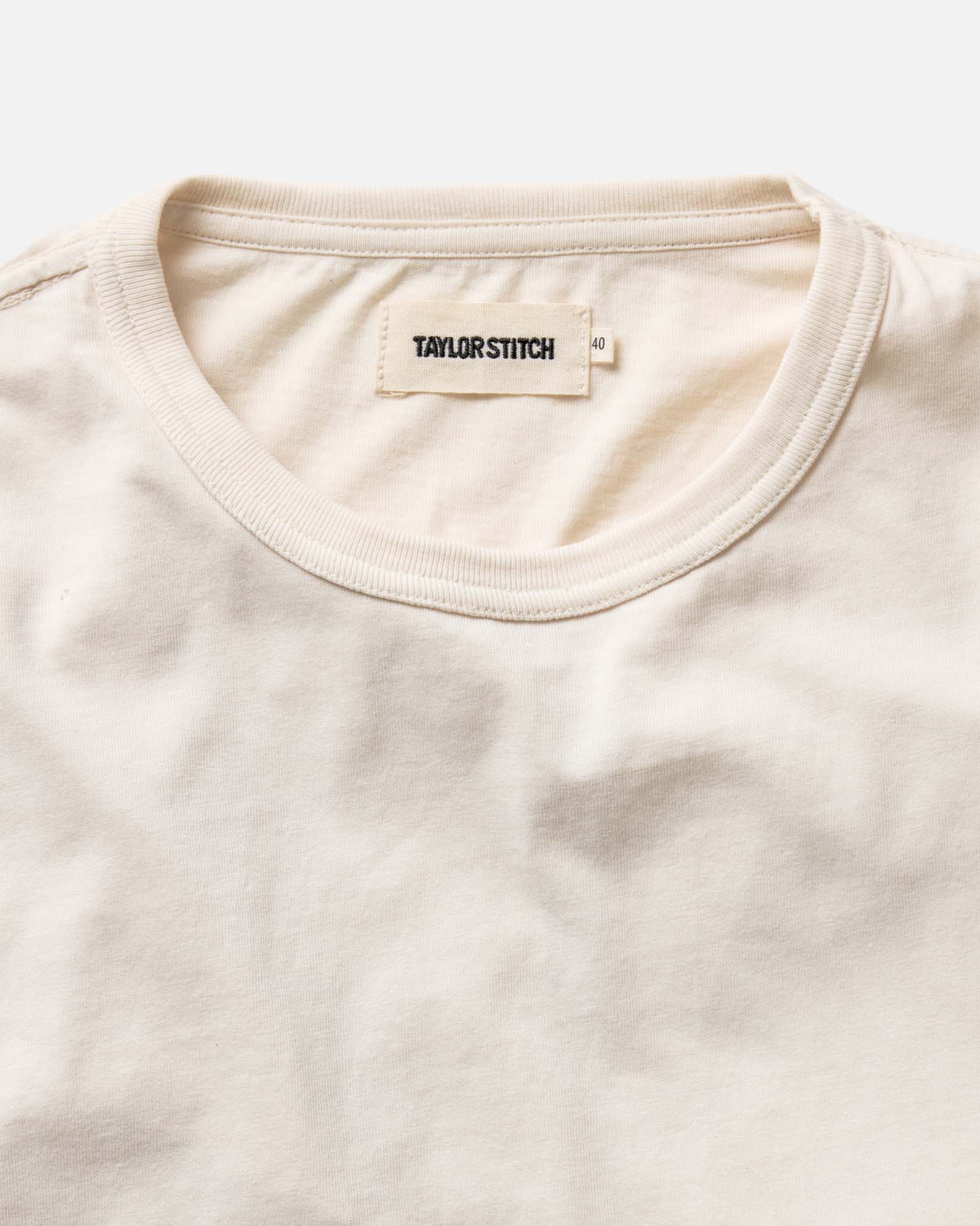 material shot of the sleeve on The Organic Cotton Long Sleeve Tee in Vintage White, Knits by Taylor Stitch