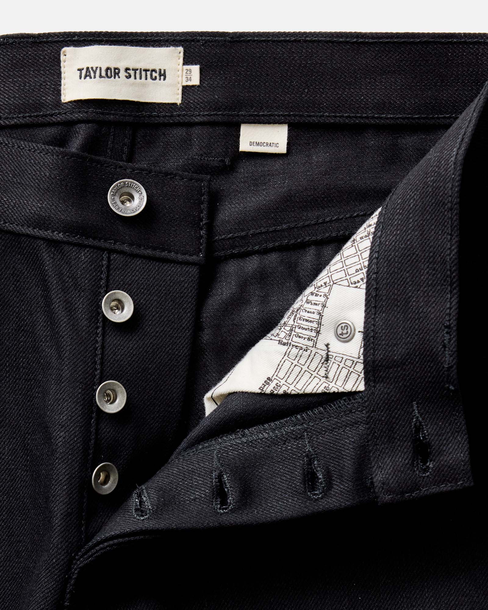flatlay of The Democratic Jean in Rigid Black Organic Selvedge, Bottoms by Taylor Stitch