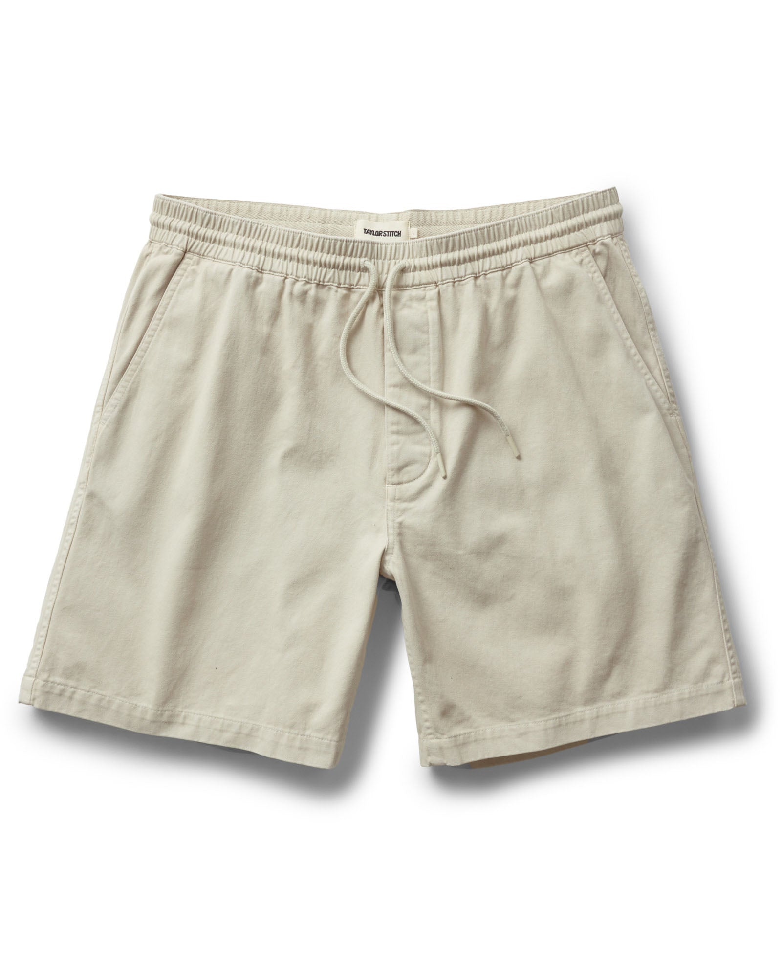 flatlay of The Apres Short in Organic Aged Stone Foundation Twill, Bottoms by Taylor Stitch