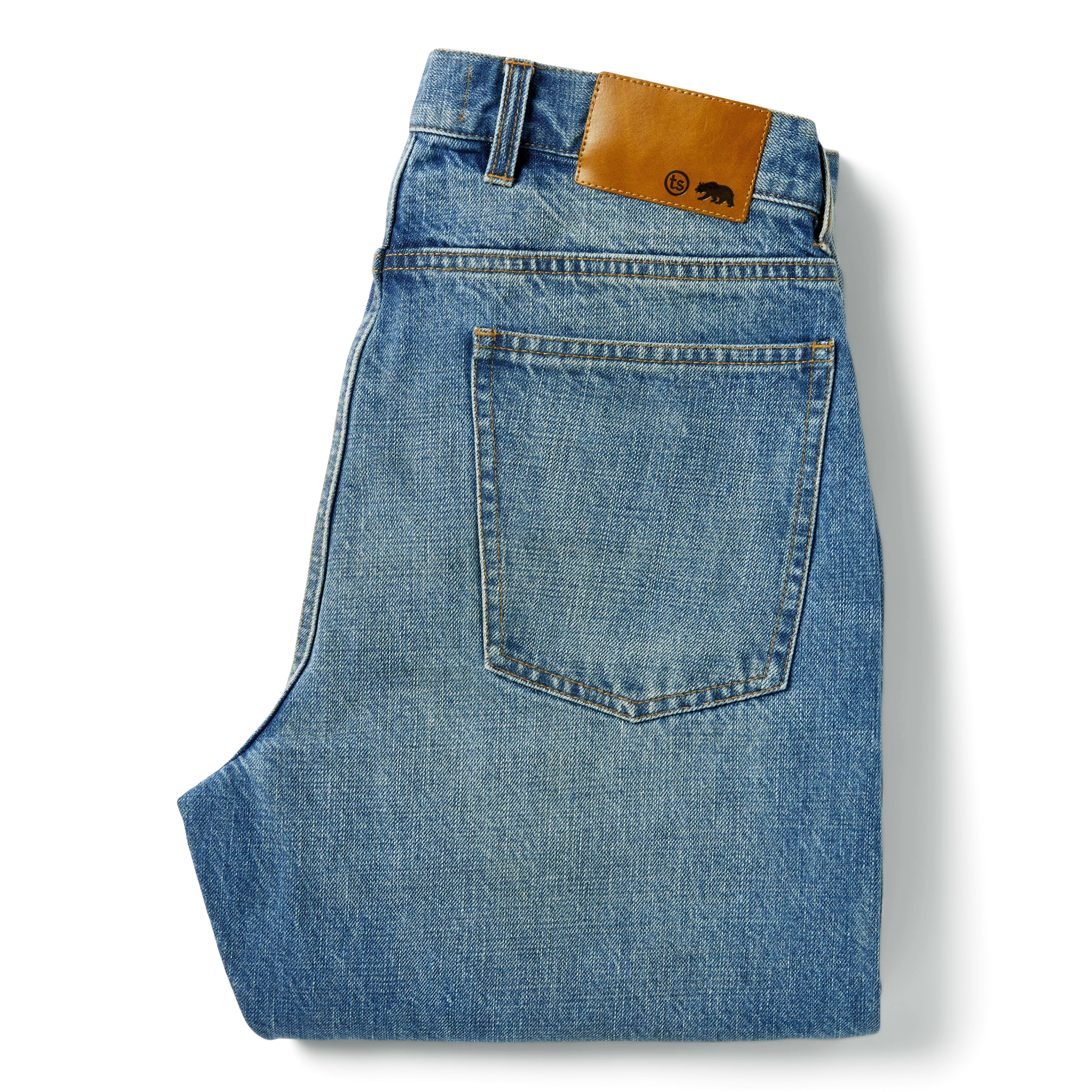 flatlay of The Democratic Jean in Patch Wash Selvage, shown folded from the back, Bottoms by Taylor Stitch