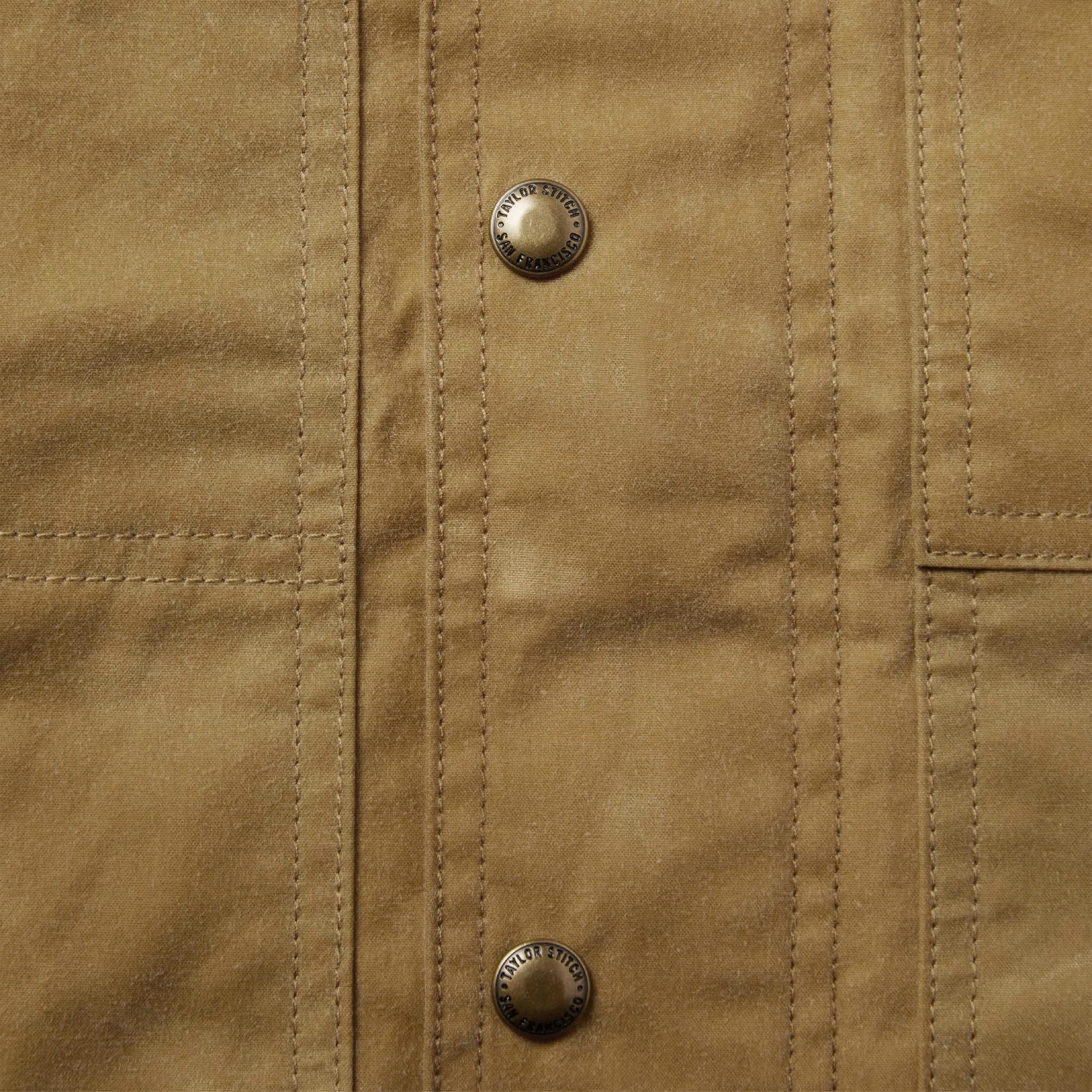 material shot of the buttons on The Lined Longshore Jacket in Harvest Tan Waxed Canvas, Outerwear by Taylor Stitch
