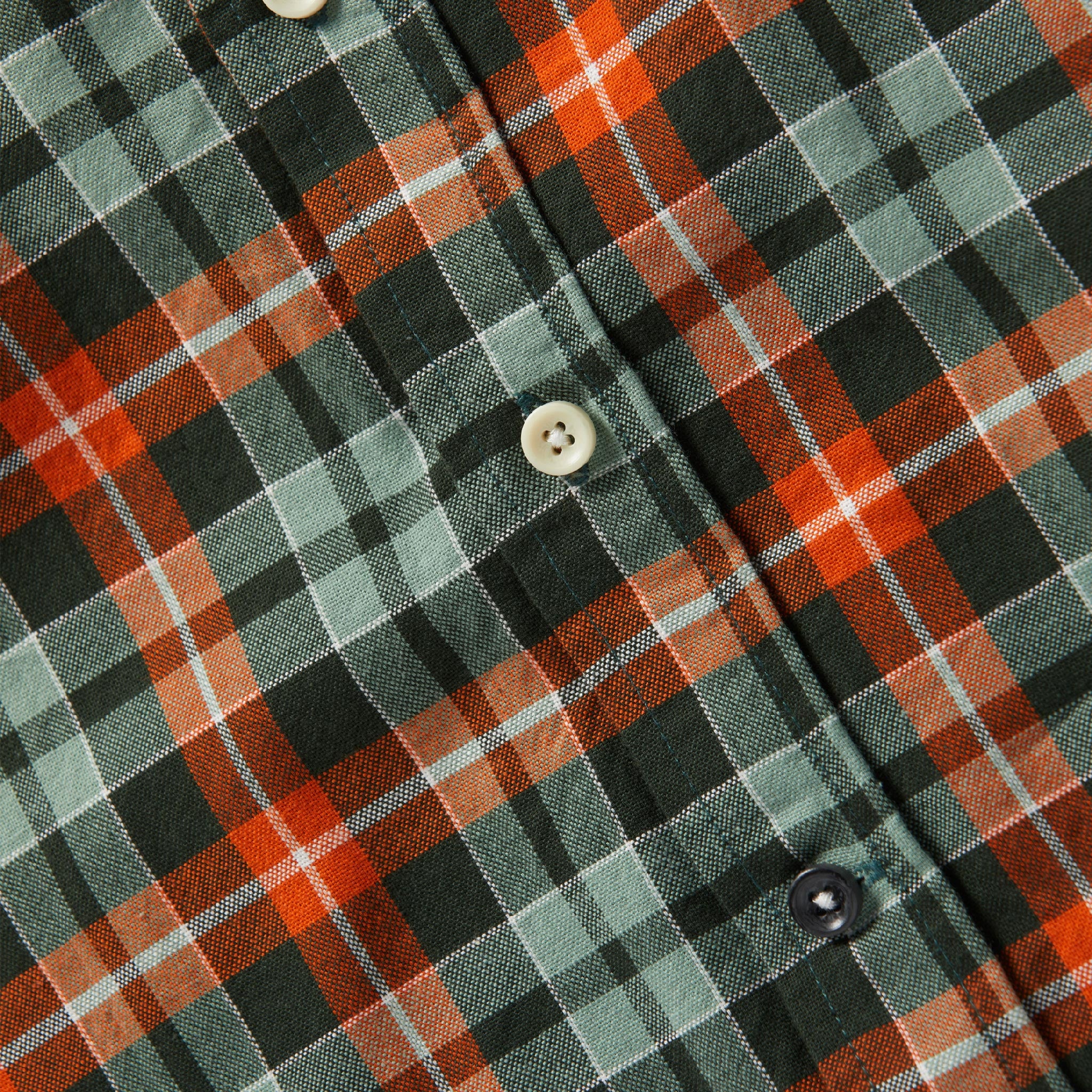 material shot of front placket and buttons of The Jack in Rust Plaid Oxford, Wovens by Taylor Stitch