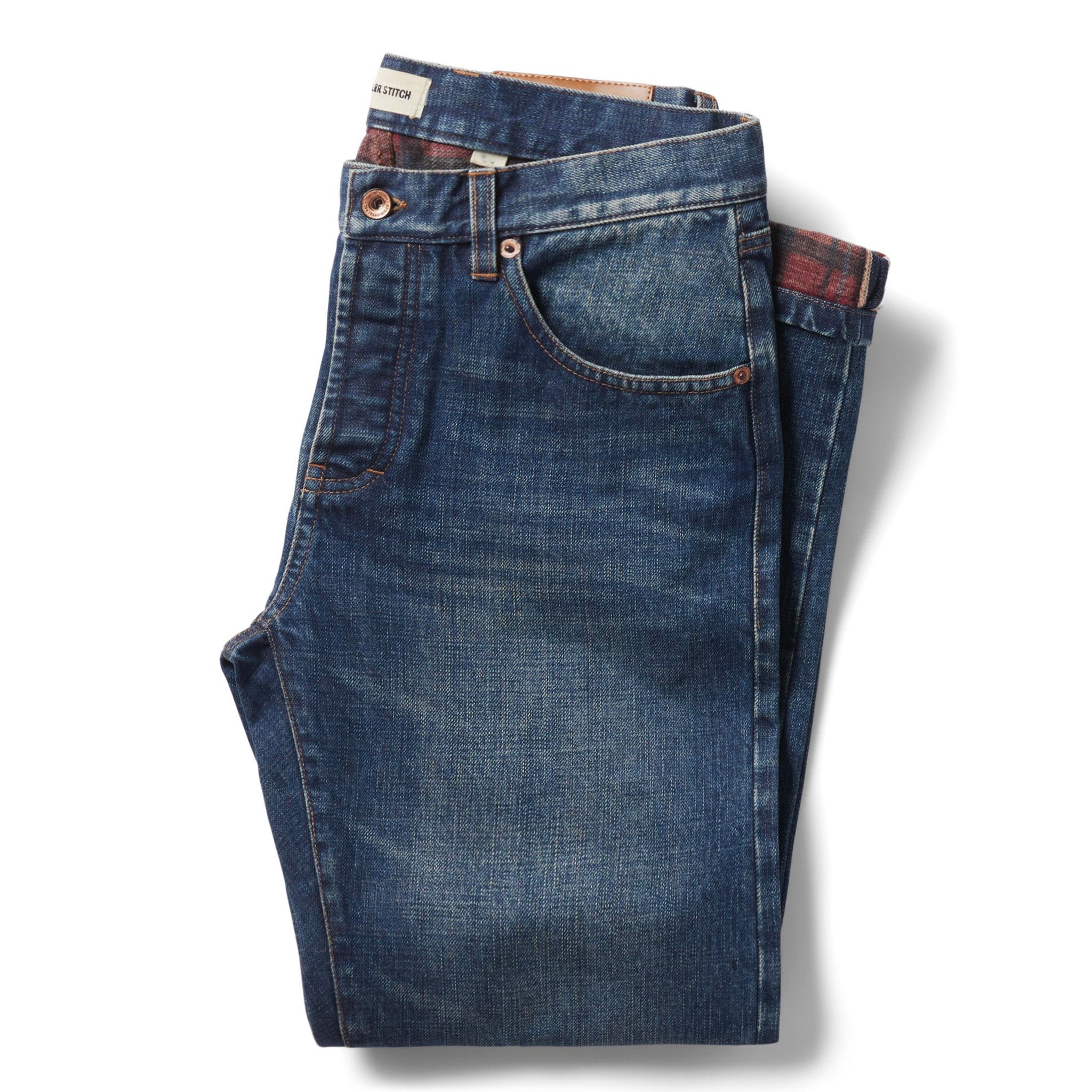 flatlay of The Democratic Brushed Back Jean in Sawyer Wash Organic Selvage folded, Bottoms by Taylor Stitch