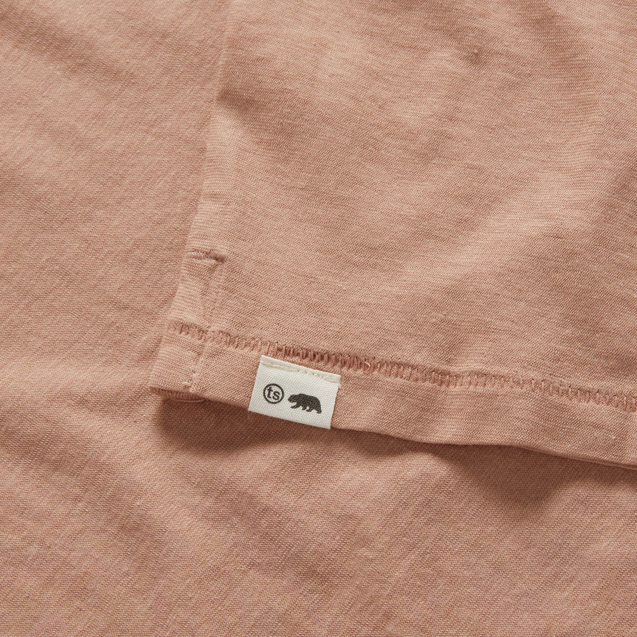 material shot of the hem on The Cotton Hemp Polo in Dried Acorn, Knits by Taylor Stitch