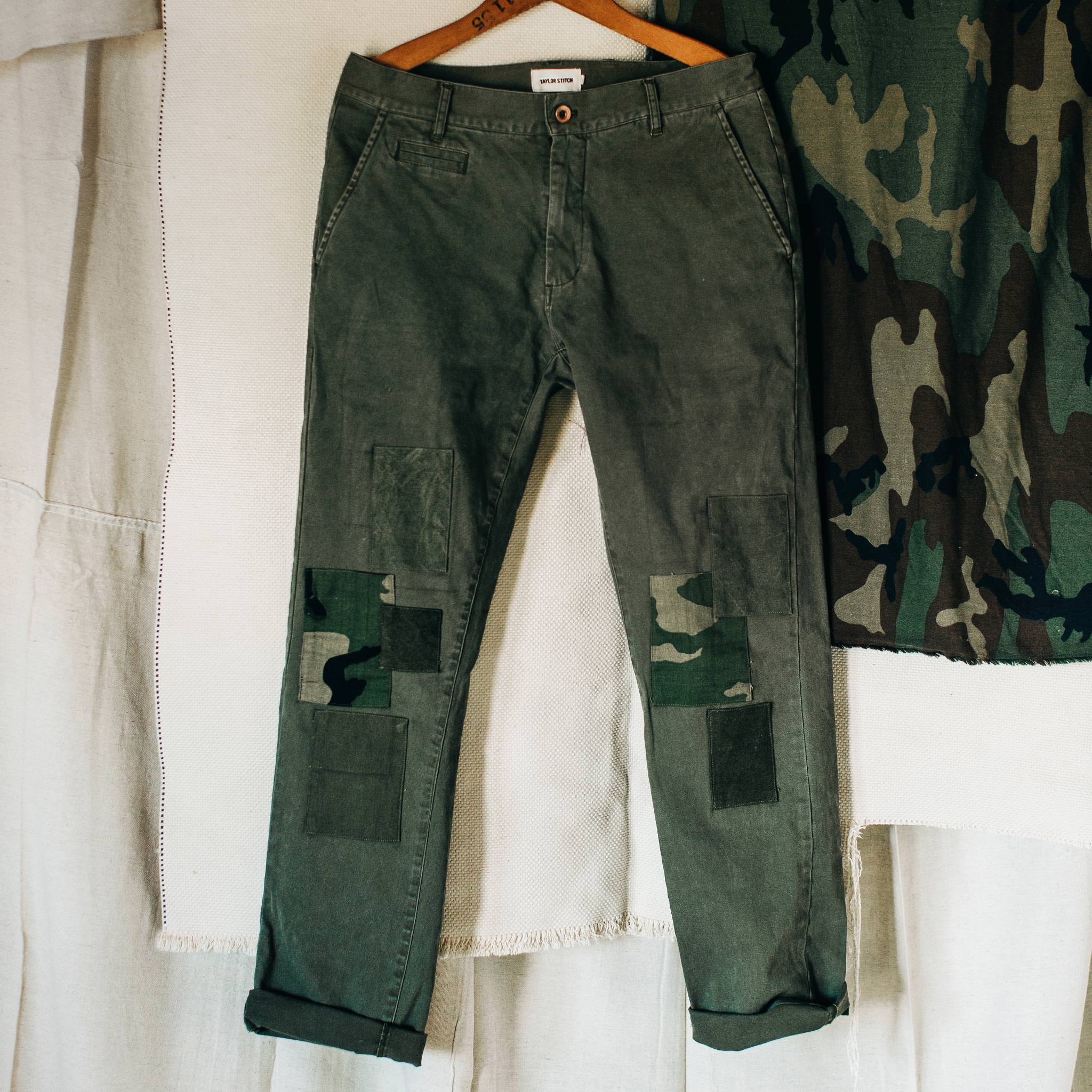 material shot of The Atelier and Repairs Chino in Olive, on hanger, Bottoms by Taylor Stitch