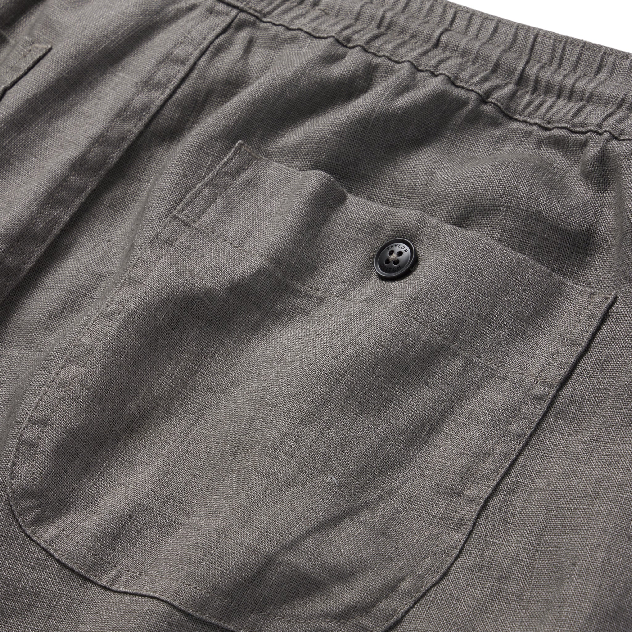 material shot of the rear pocket on The Apres Short in Ash Hemp, Shorts by Taylor Stitch