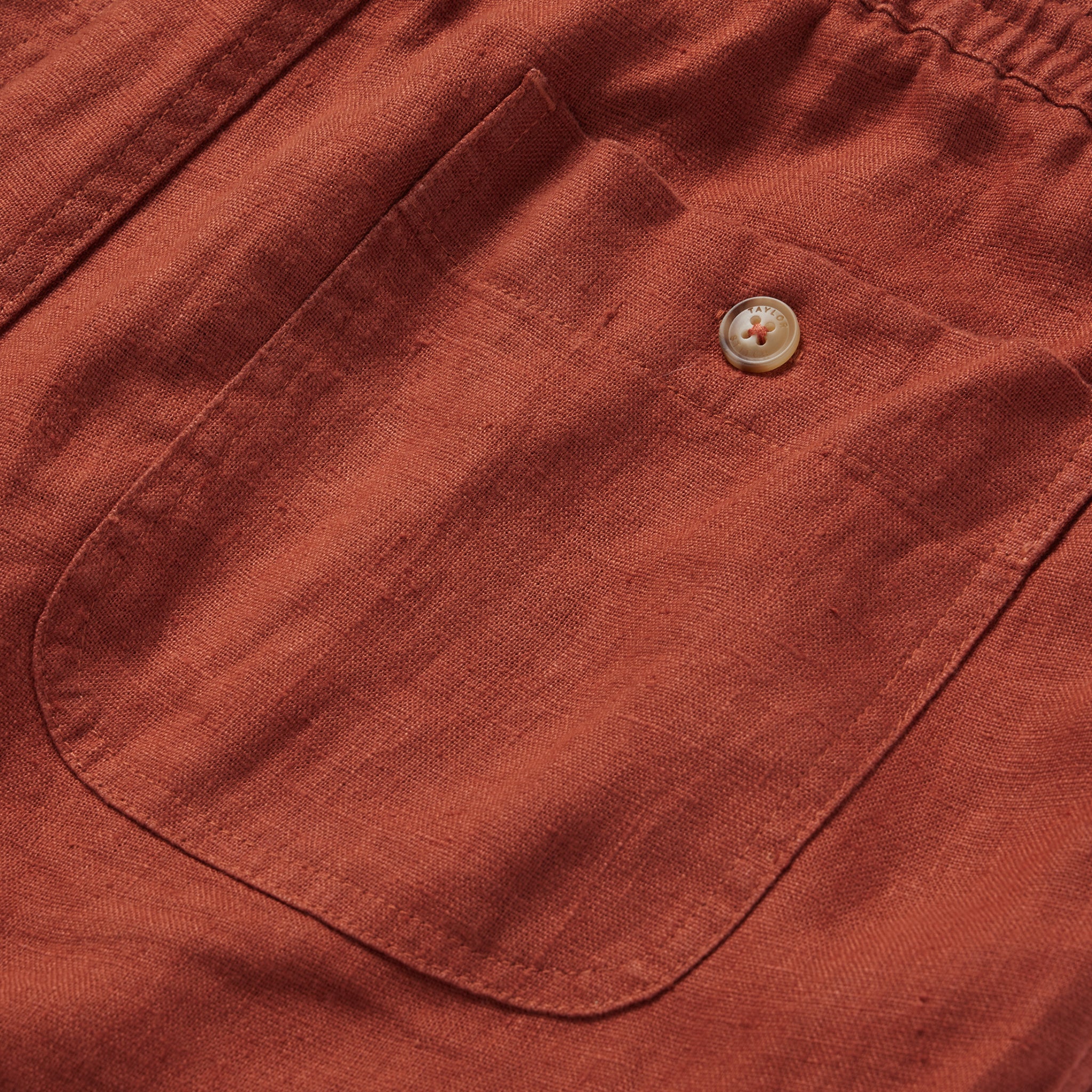 material shot of the rear pocket on The Apres Short in Sienna Hemp, Shorts by Taylor Stitch