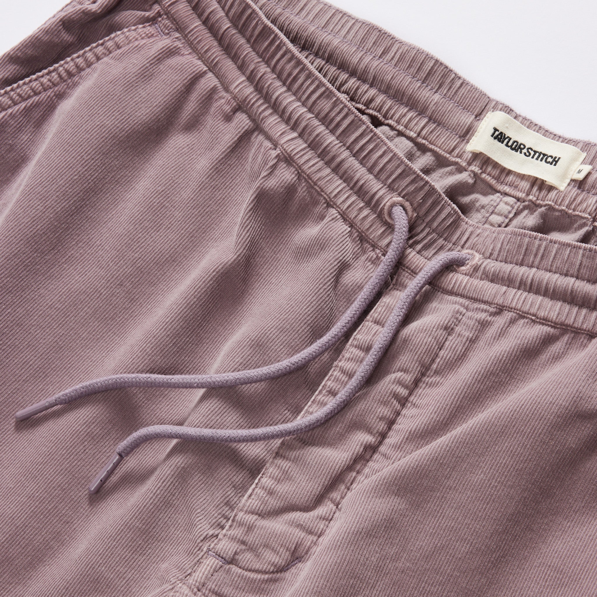 material shot of the drawcords on The Apres Short in Poppy Seed Micro Cord, Bottoms by Taylor Stitch