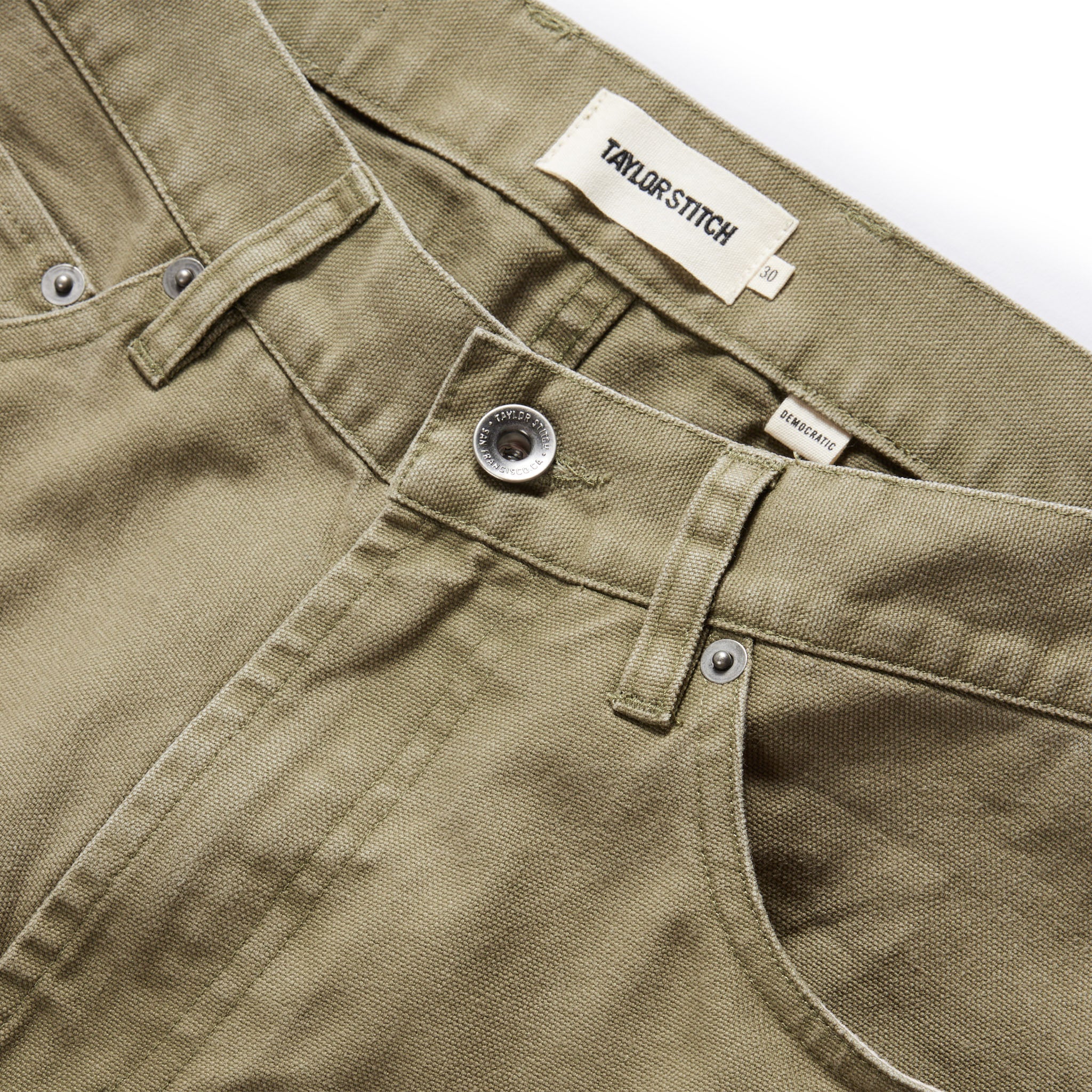 material shot of the button fly on The Democratic All Day Pant in Arid Eucalyptus Canvas, Bottoms by Taylor Stitch