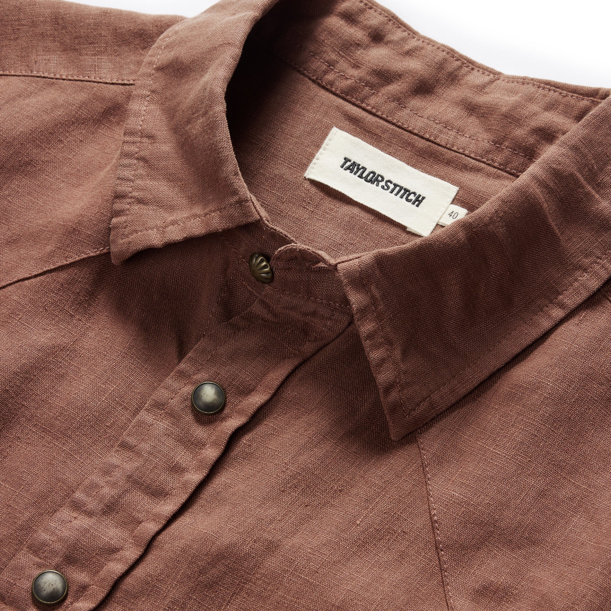 material shot of the collar and the concho button on The Short Sleeve Western in Dried Guajillo, Wovens by Taylor Stitch