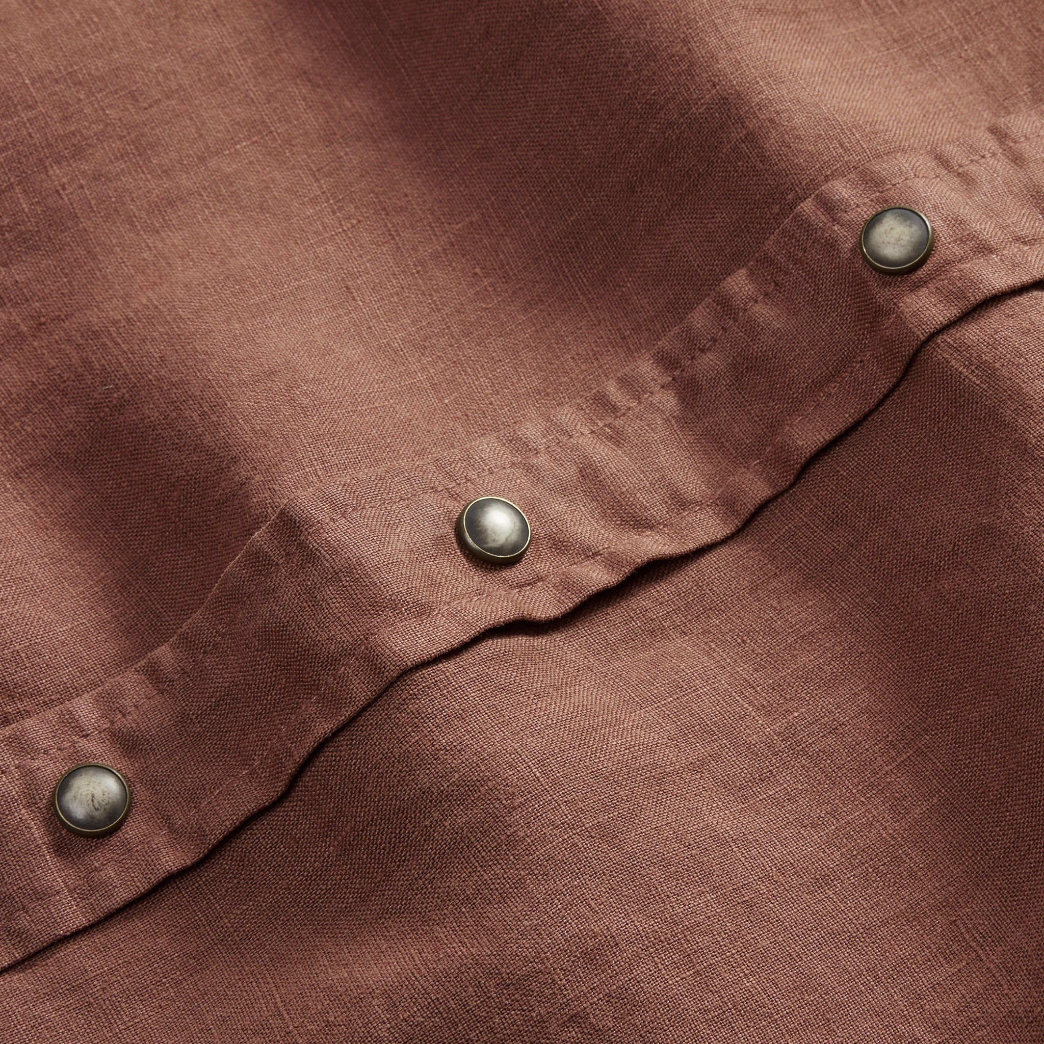 material shot of the snap buttons on The Short Sleeve Western in Dried Guajillo, Wovens by Taylor Stitch