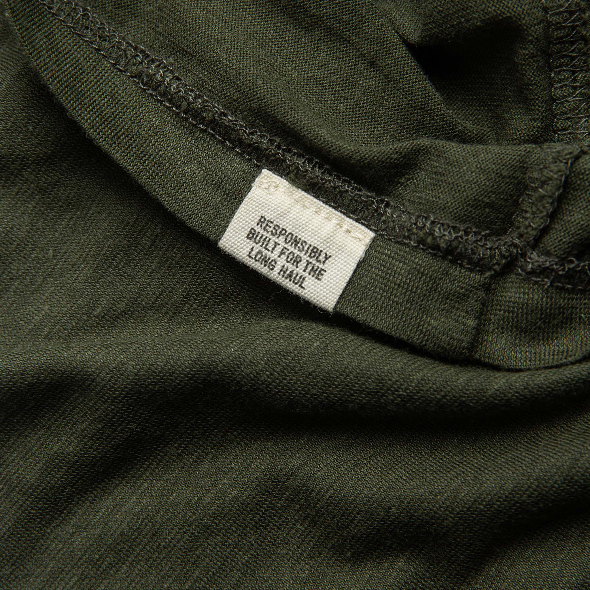 material shot of tag on hem of tee shirt, Knits by Taylor Stitch