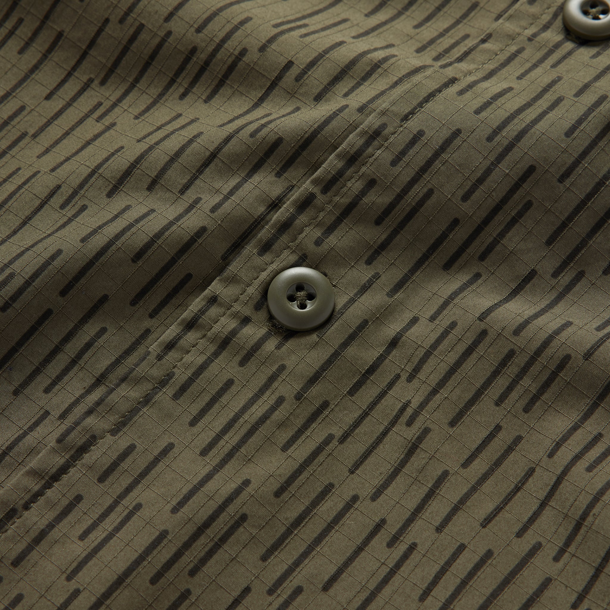 material shot of the buttons on The Point Shirt in Rain Drop Camo, Wovens by Taylor Stitch