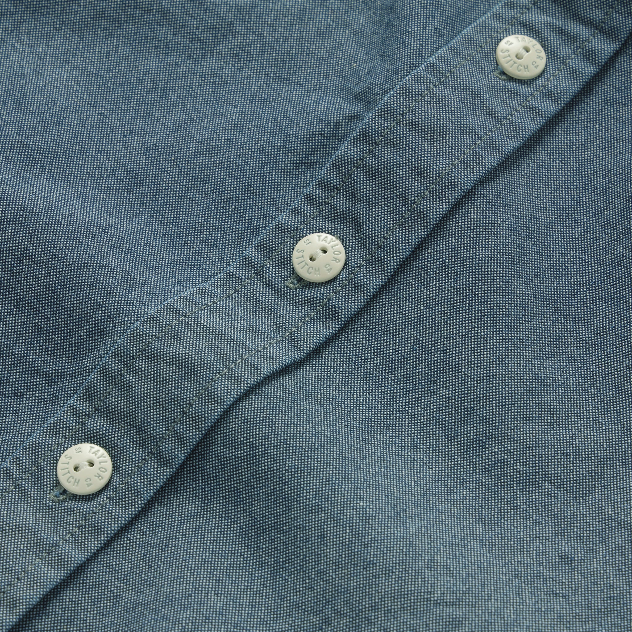 material shot of the buttons on The Utility Shirt in Rinsed Selvage Chambray, Wovens by Taylor Stitch