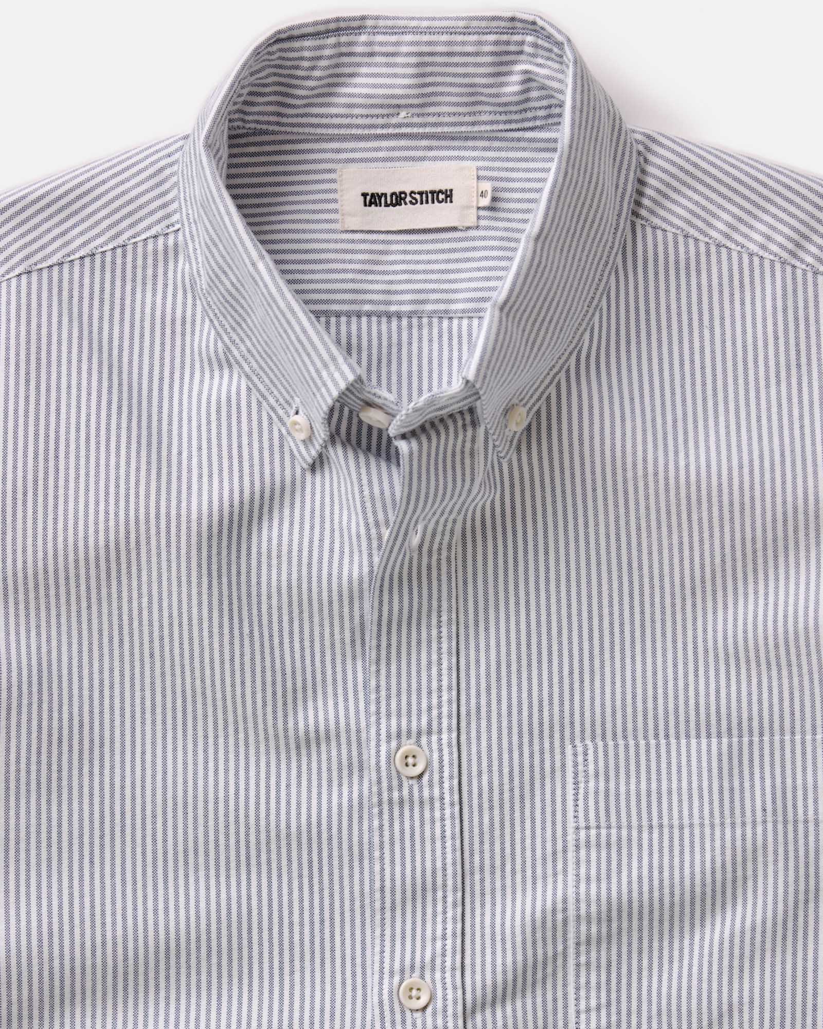 flatlay of The Jack in Navy University Stripe Everyday Oxford, shown in full, Wovens by Taylor Stitch
