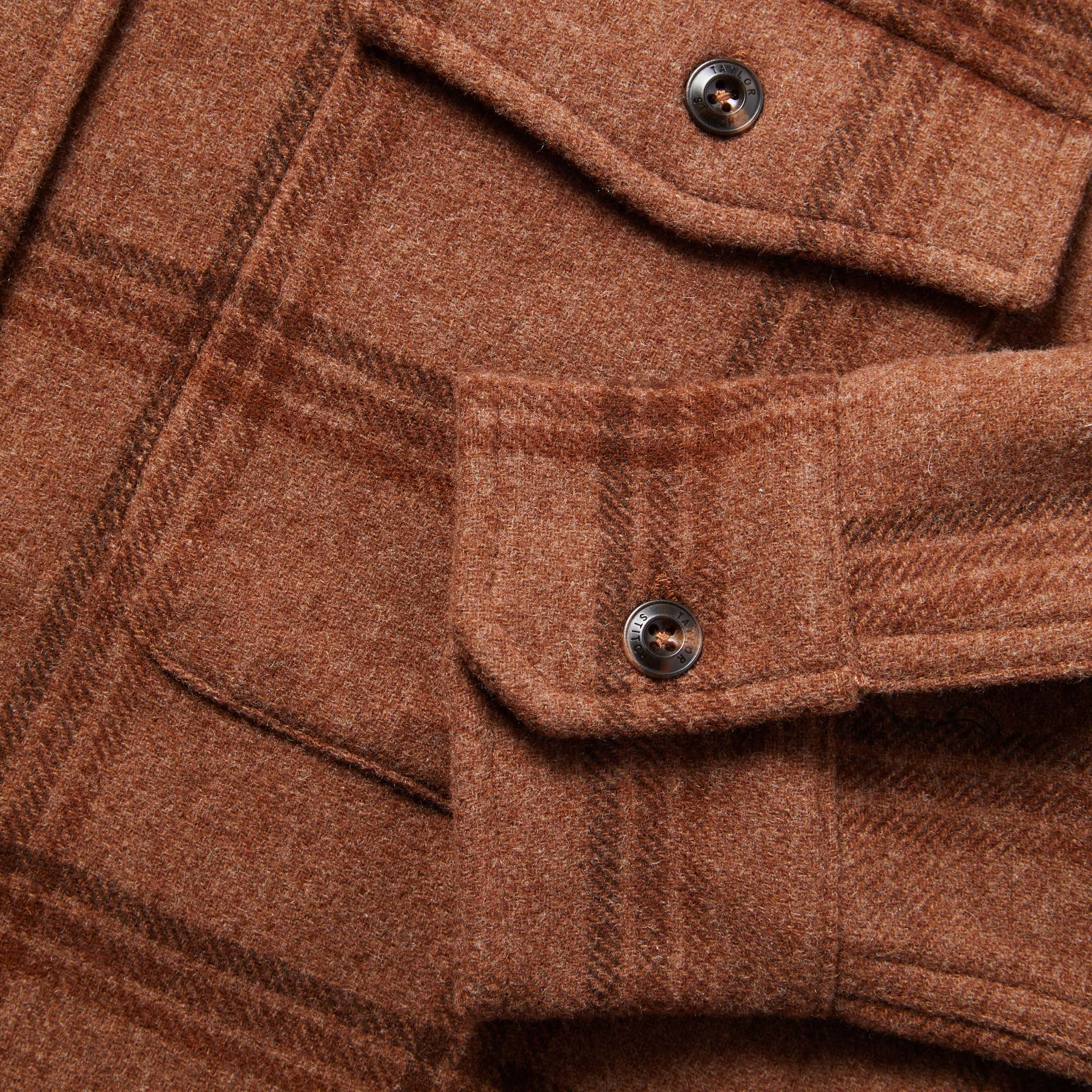 material shot of The Maritime Shirt in Espresso Plaid Wool showing chest pocket and sleeve cuff button, Wovens by Taylor Stitch