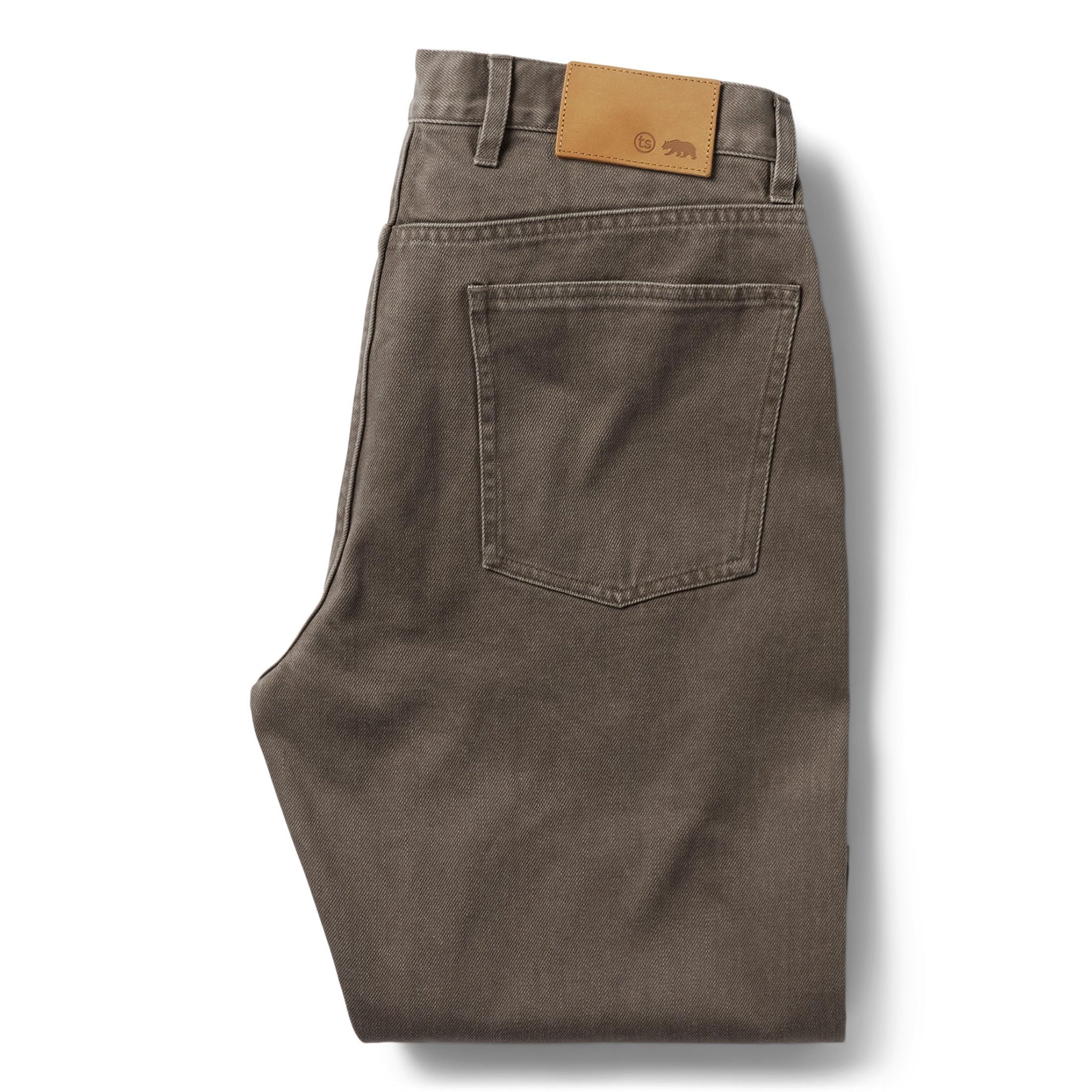 flatlay of The Democratic All Day Pant in Washed Walnut Selvage, shown folded from the back, Bottoms by Taylor Stitch