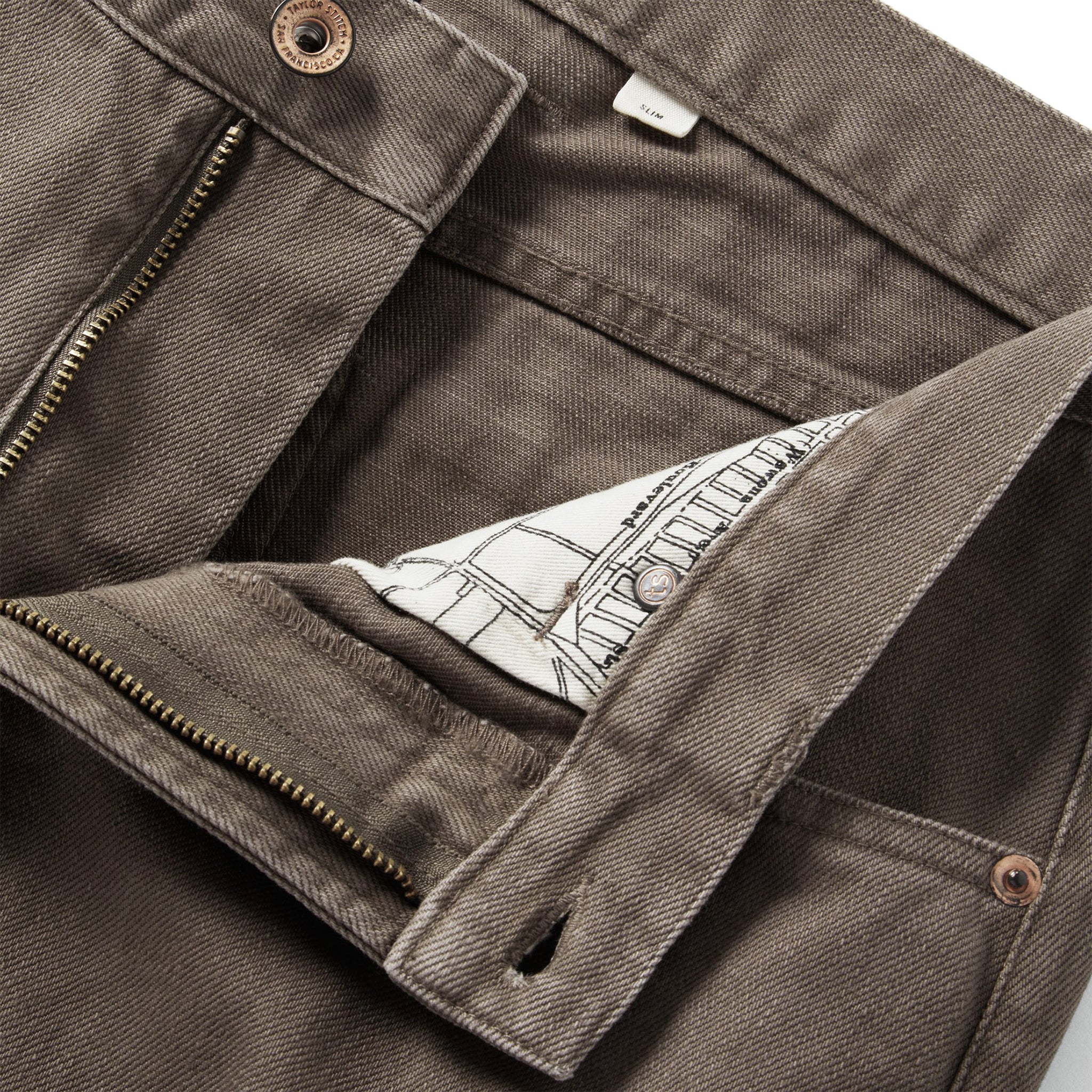 material shot of the YKK zipper fly on The Democratic All Day Pant in Washed Walnut Selvage, Bottoms by Taylor Stitch