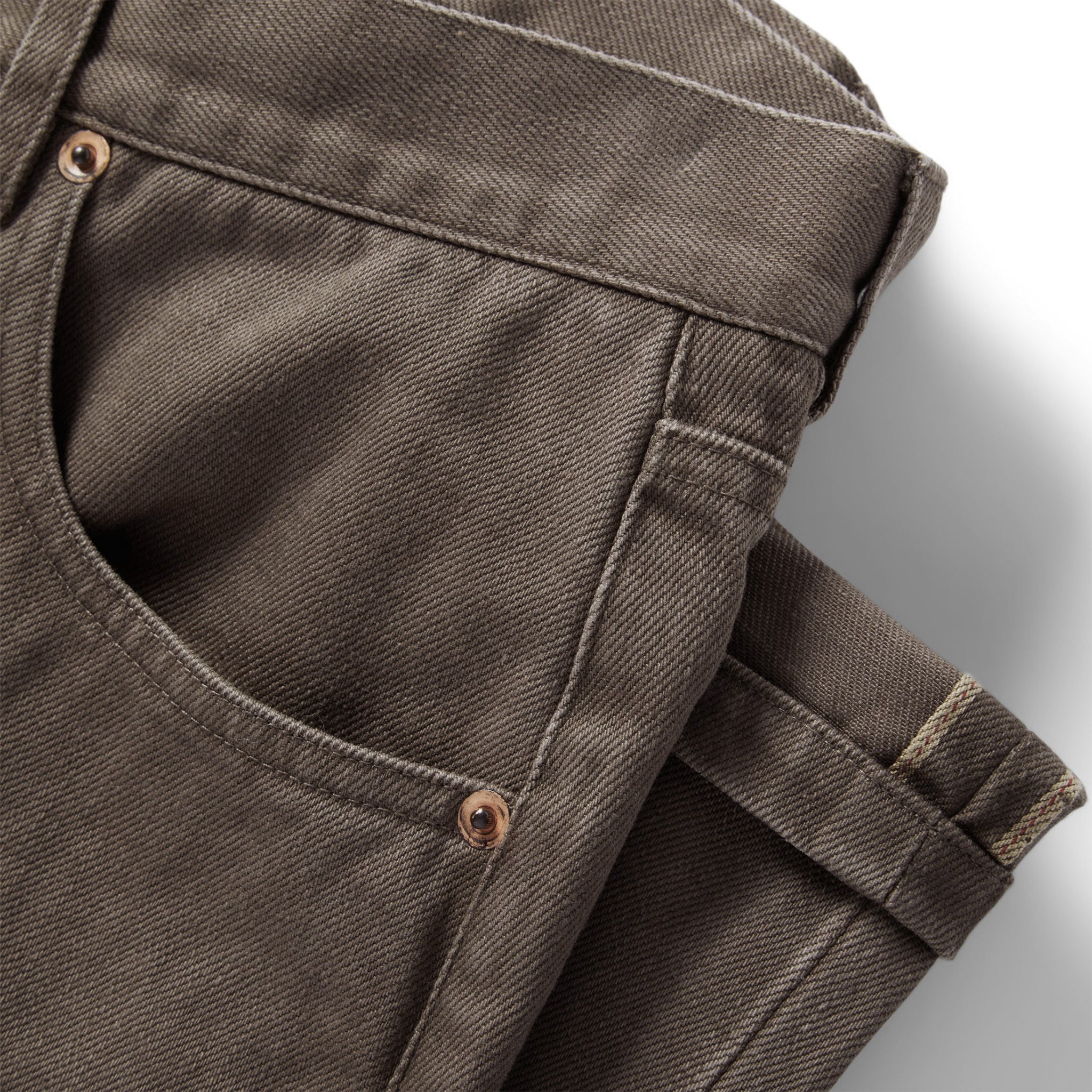 material shot of the pockets on The Democratic All Day Pant in Washed Walnut Selvage, Bottoms by Taylor Stitch