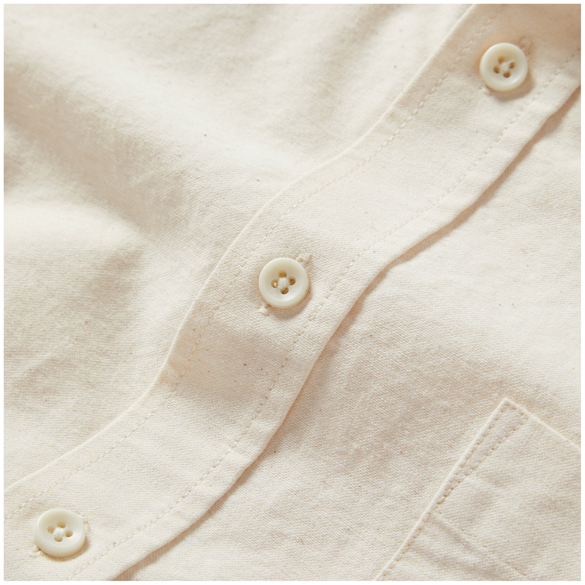 material shot of the buttons on The Jack in Sand Oxford, Wovens by Taylor Stitch