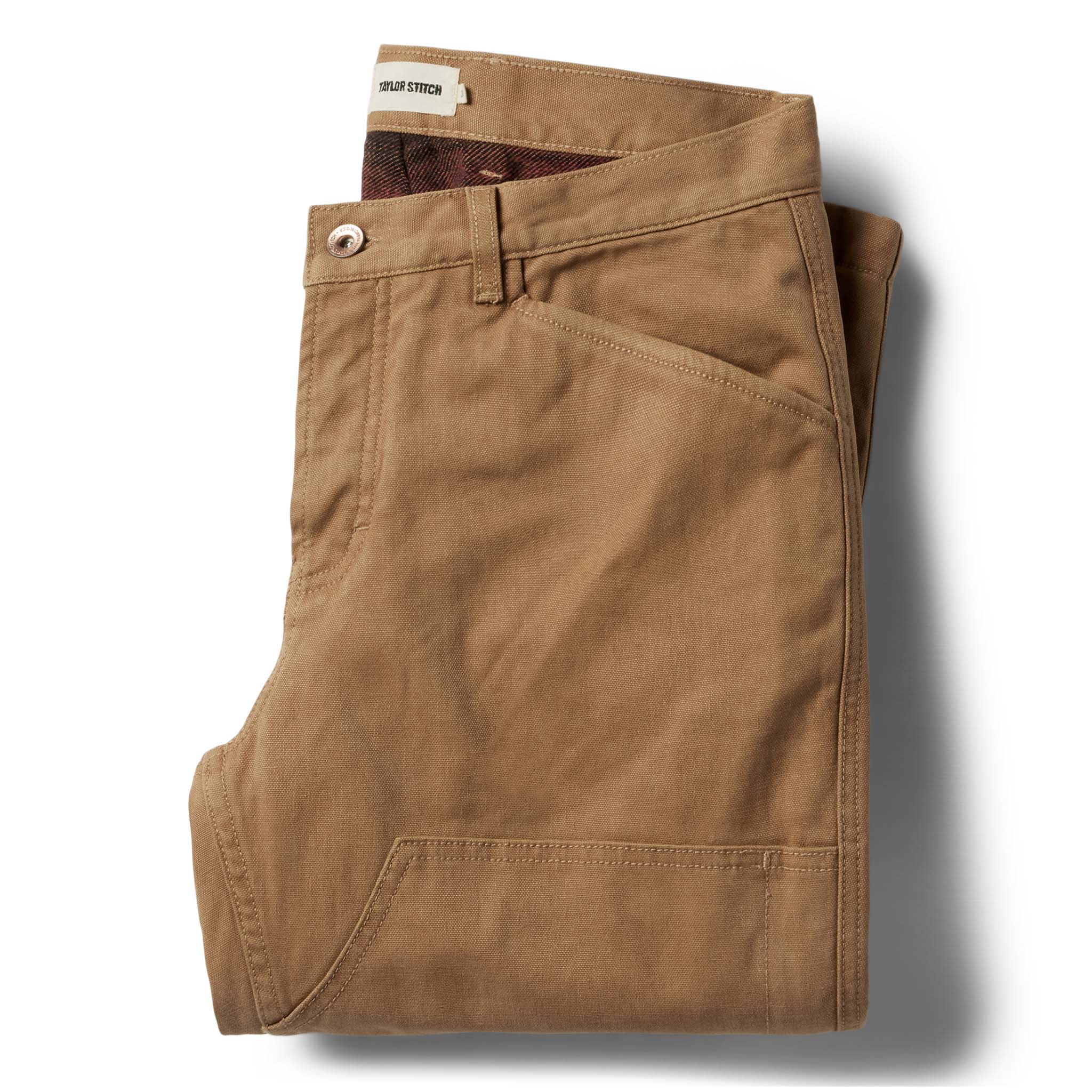 flatlay of The Lined Chore Pant in Tobacco Boss Duck folded, Bottoms by Taylor Stitch