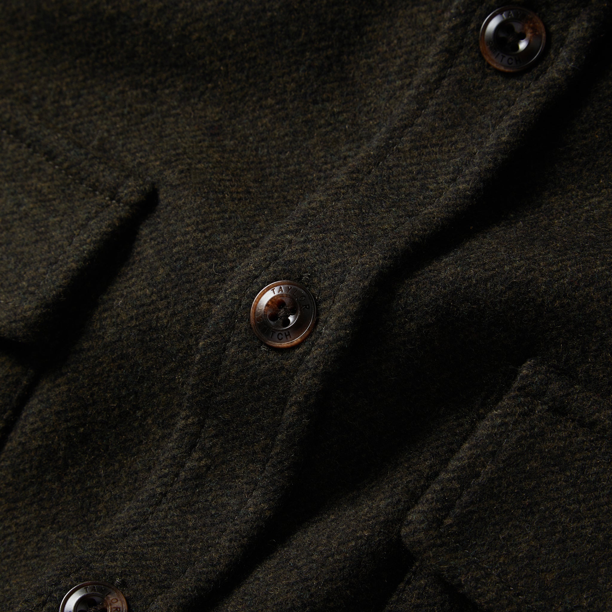 material shot of the buttons on The Maritime Shirt Jacket in Evergreen Twill, Wovens by Taylor Stitch