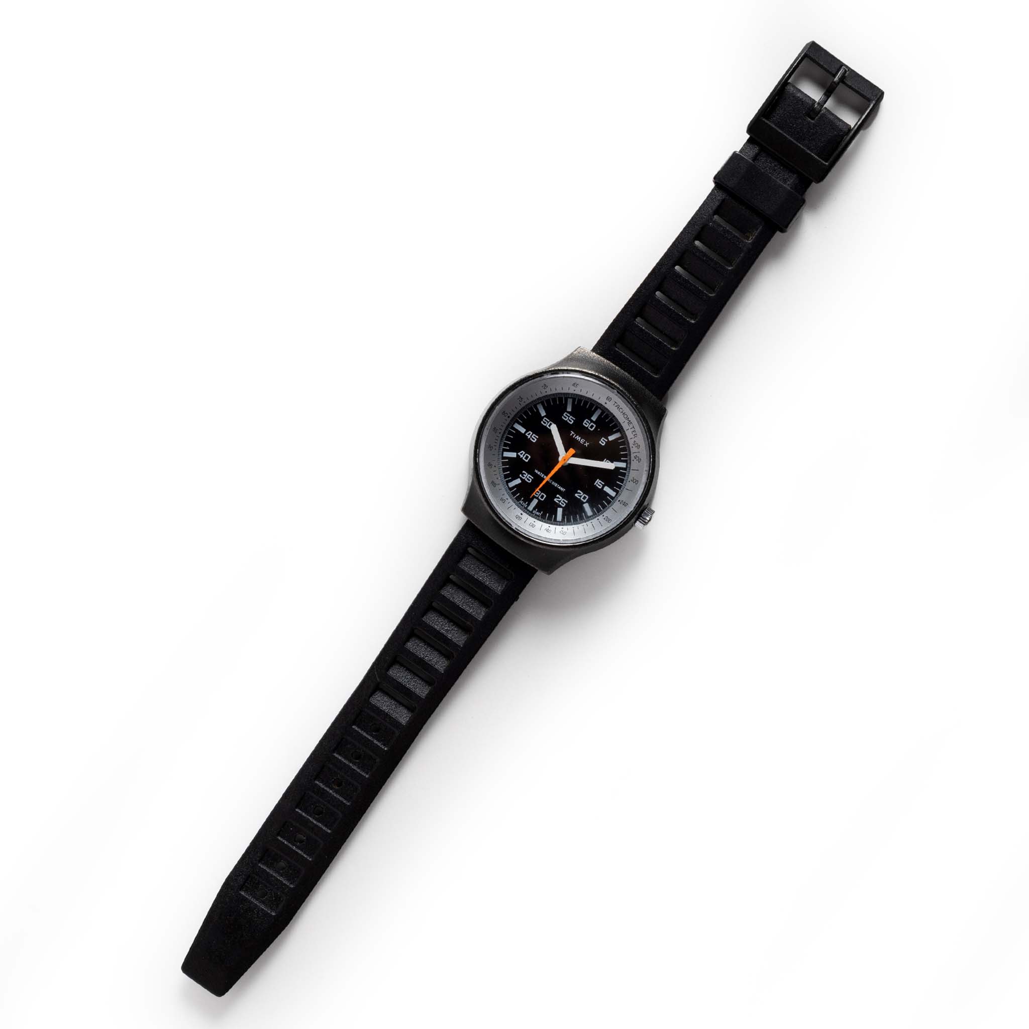 flatlay of the 1977 Timex Black Max, Accessories by Taylor Stitch