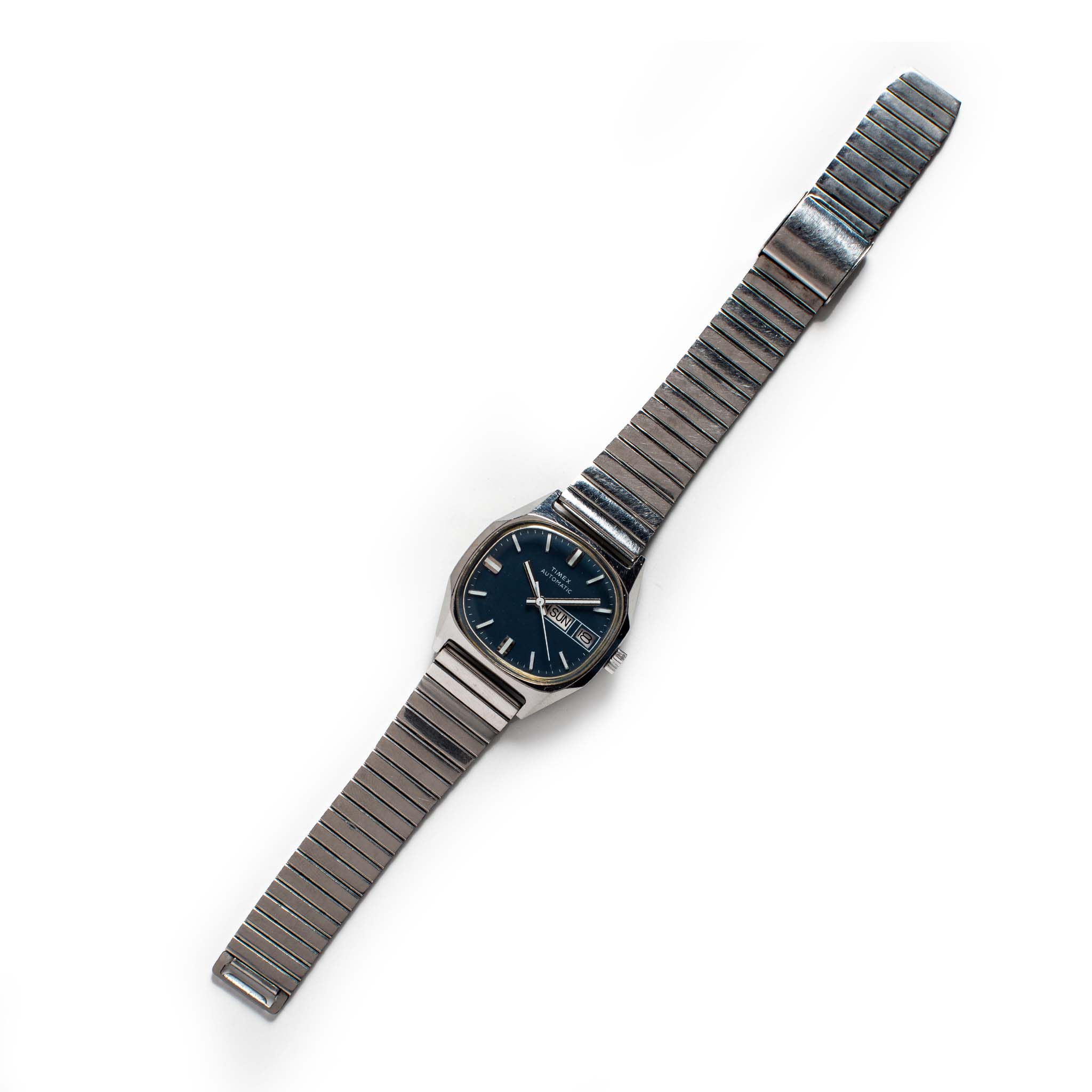 flatlay of the 1981 Timex Viscount, Accessories by Taylor Stitch