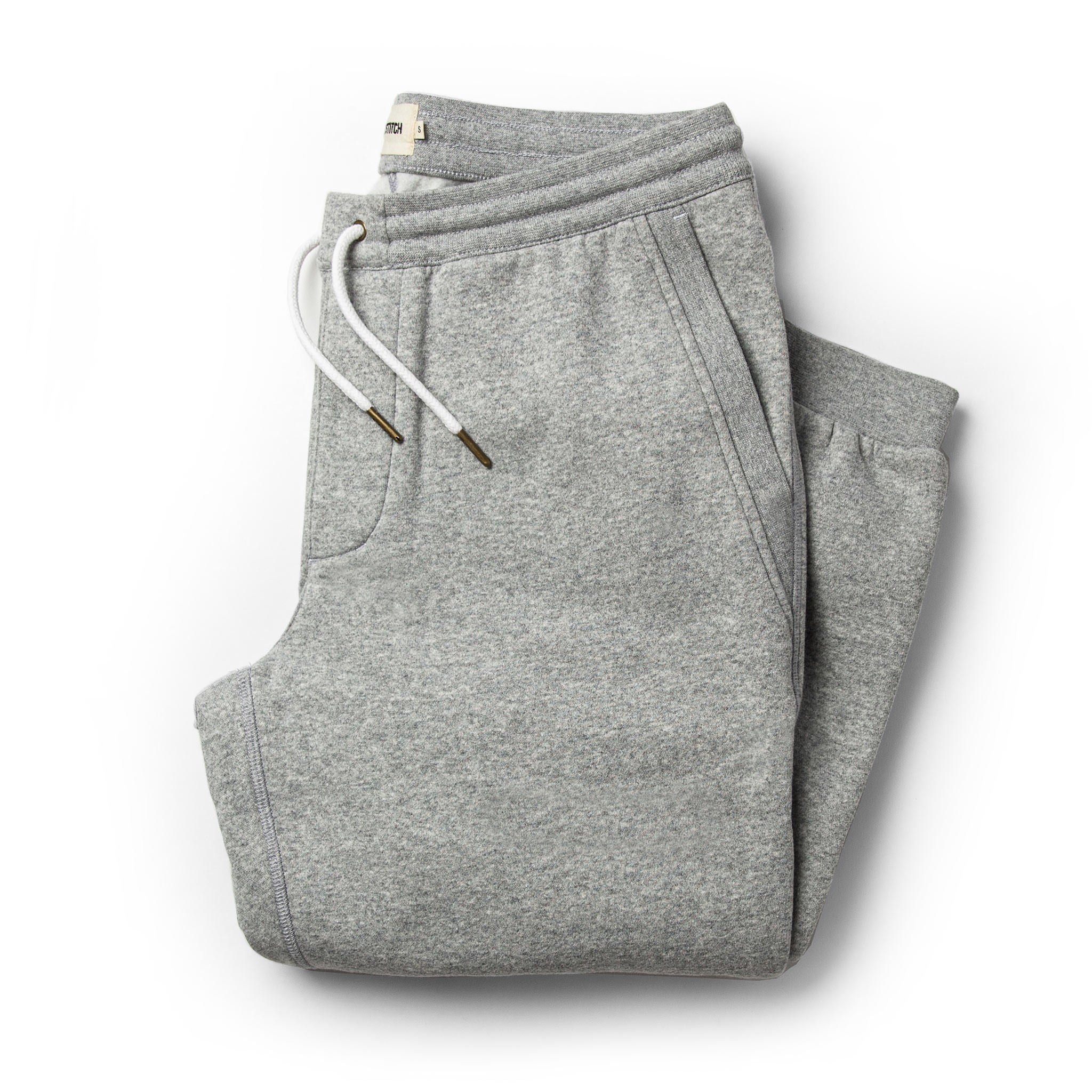 flatlay of The Heavy Bag Pant in Heather Grey Fleece folded up from the front, Pants by Taylor Stitch