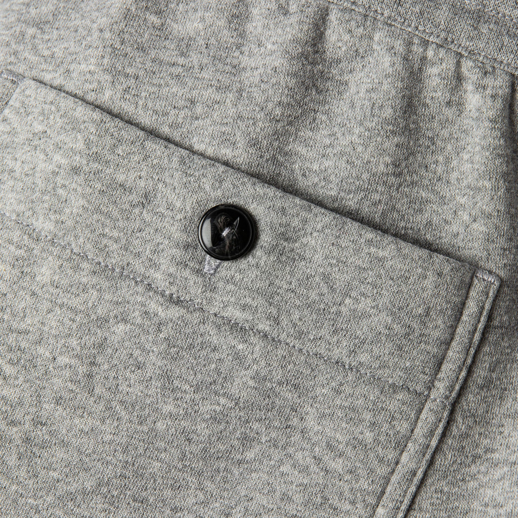 material shot of back pocket and horn button closeup of The Heavy Bag Pant in Heather Grey Fleece, Pants by Taylor Stitch