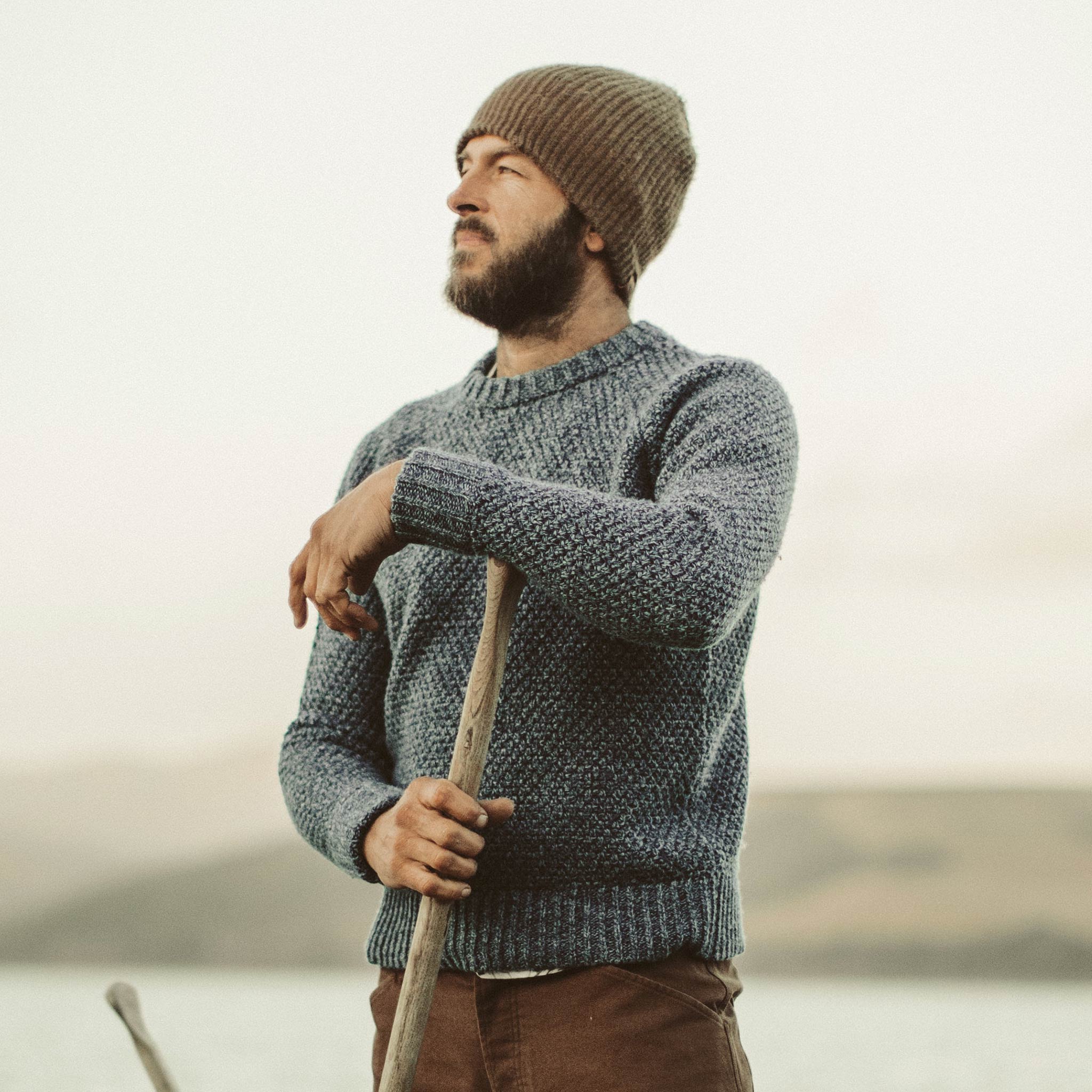 David out on the water in his Fisherman Sweater, Knits by Taylor Stitch