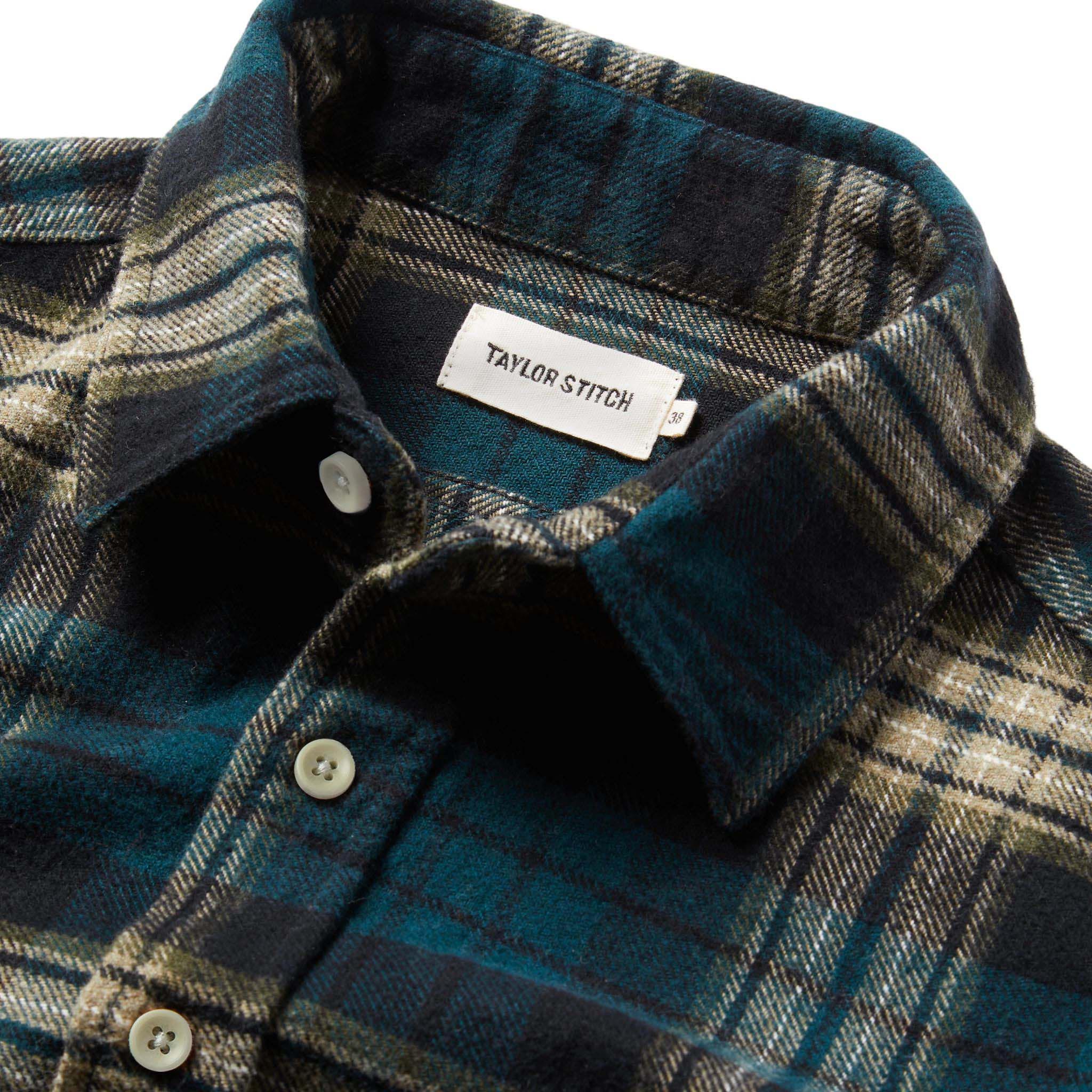 material shot of The Ledge Shirt in Deep Sea Plaid showing label, Wovens by Taylor Stitch