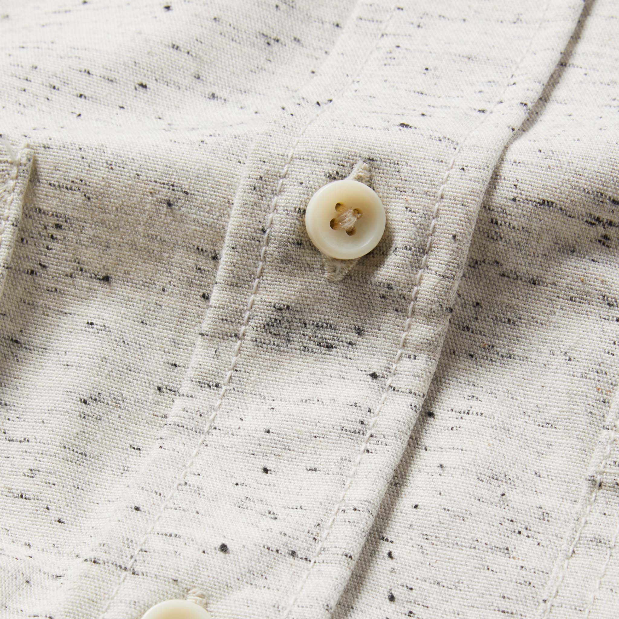 material shot of The Utility Shirt in Japanese Kuroki Natural Nep with close up of placket and button, Wovens by Taylor Stitch