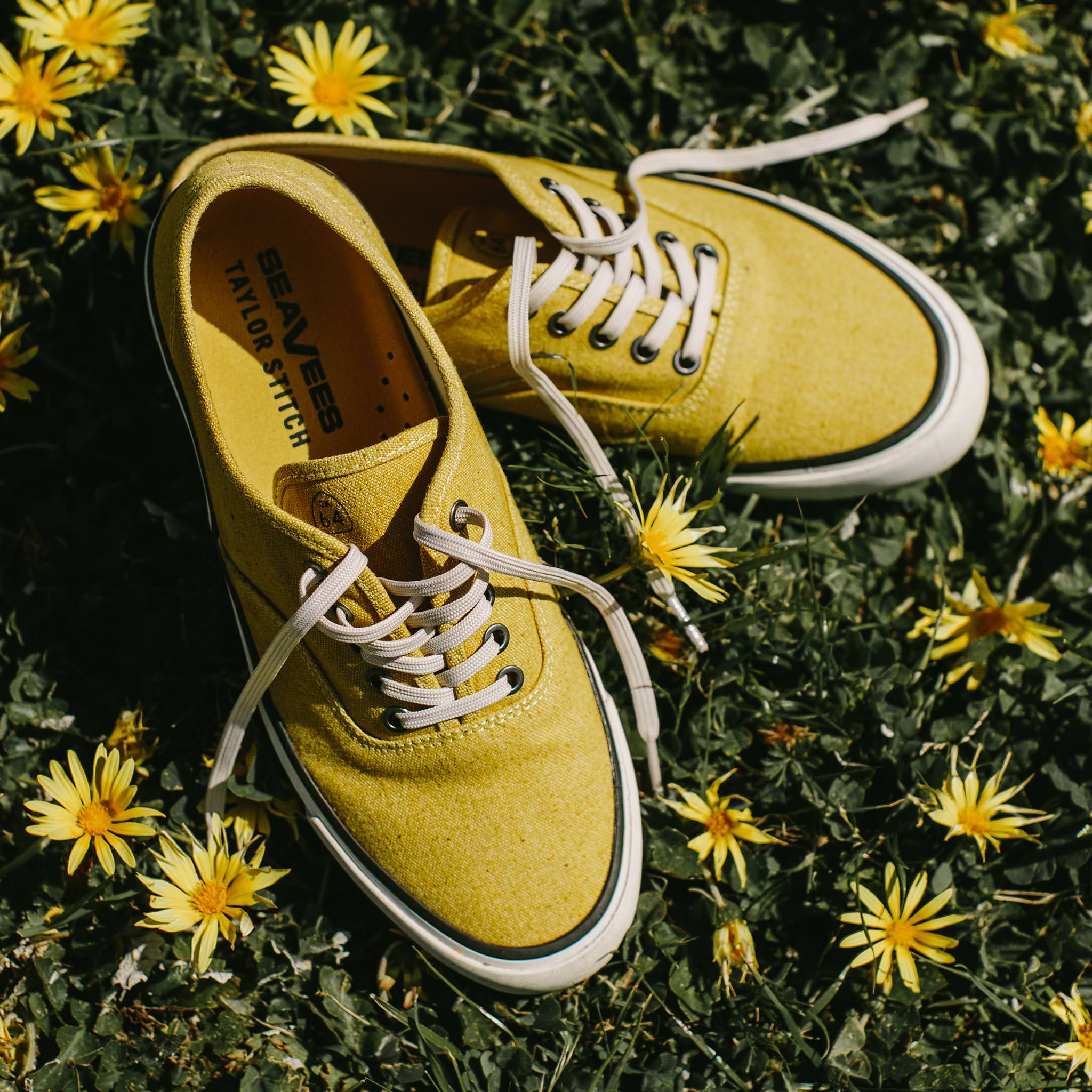 material shot of sneakers in grass, Footwear by Taylor Stitch