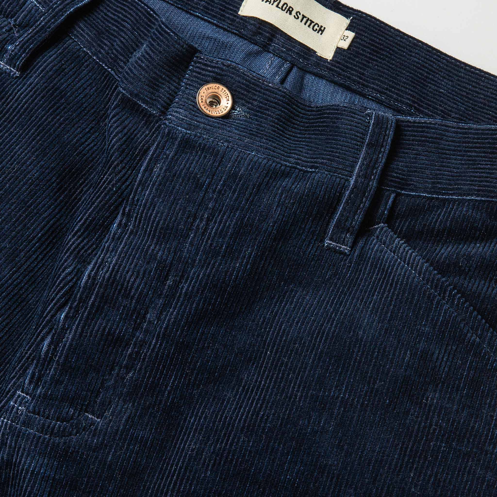material shot of The Camp Pant in Indigo Corduroy—button and pocket shot, Bottoms by Taylor Stitch