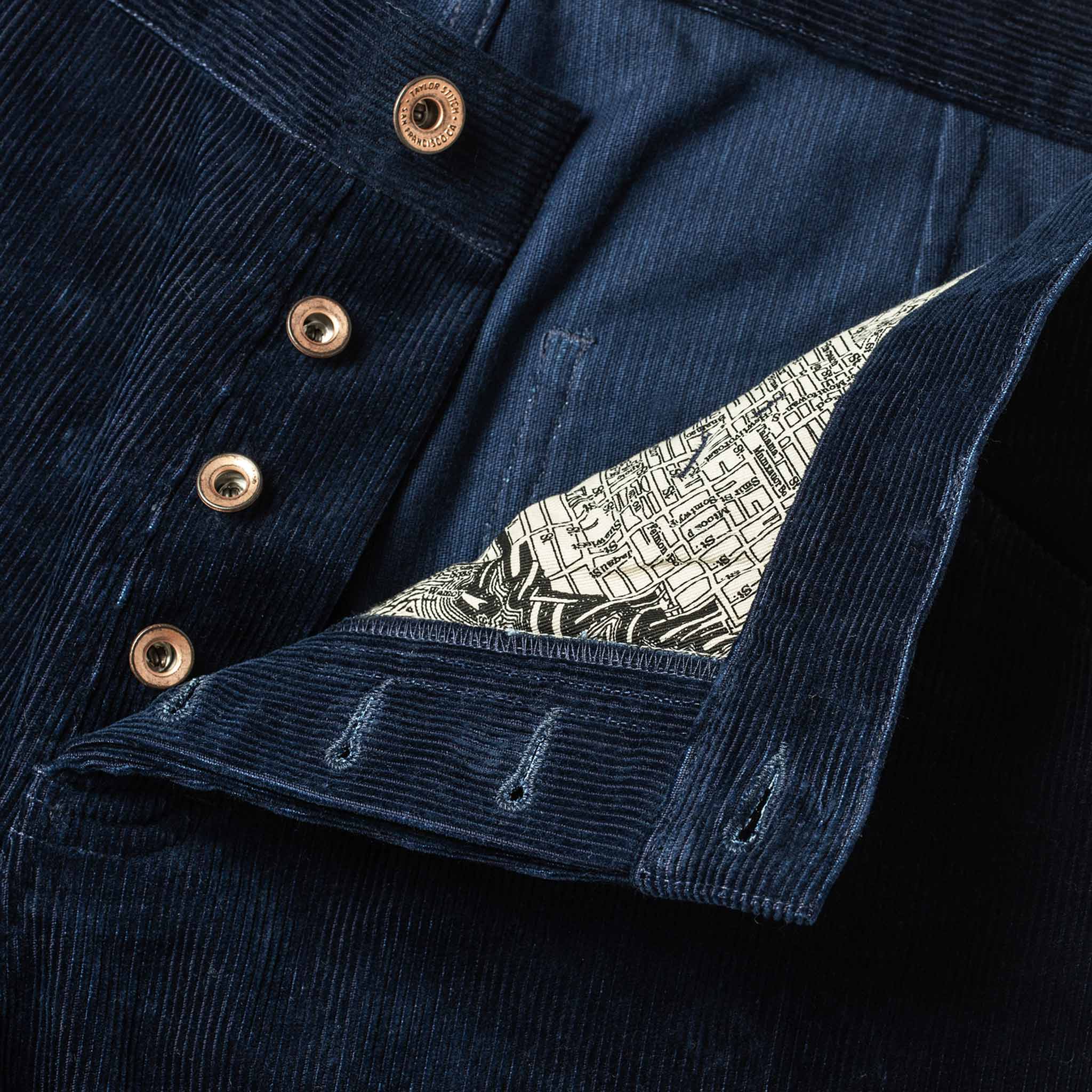 material shot of buttons and map interior , Bottoms by Taylor Stitch